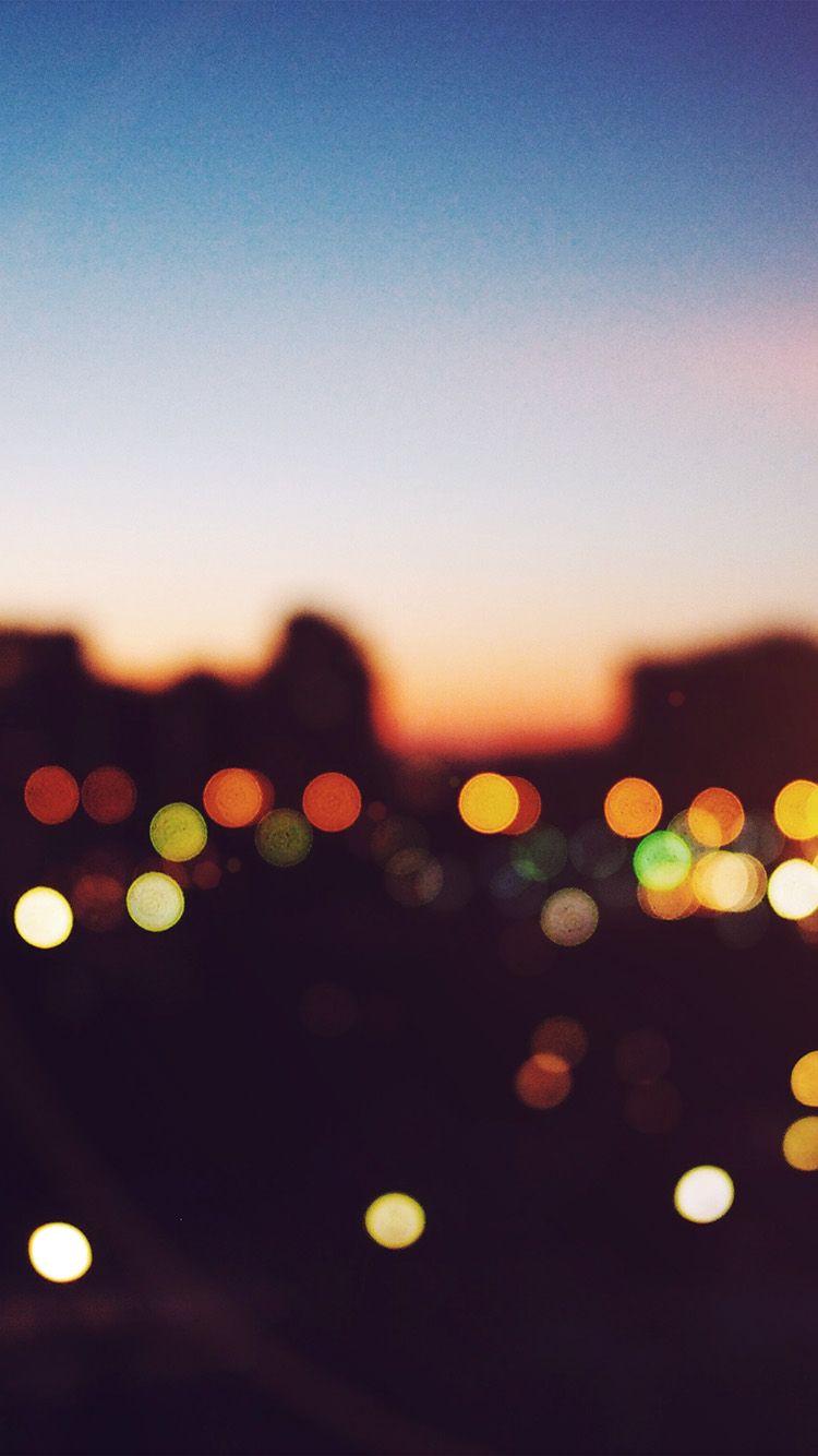 750x1334 iPhone wallpaper. light bokeh sunset city flare