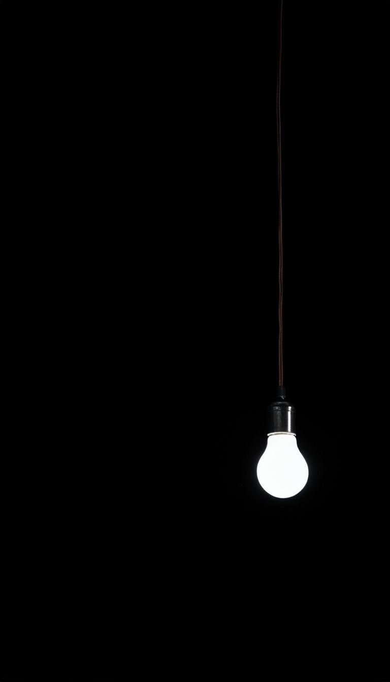 768x1344 Minimalist Incandescent Light Bulb on Black Background Mobile Wallpaper