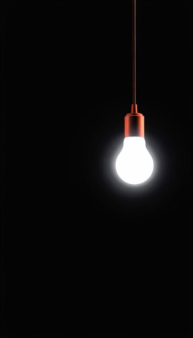 768x1344 Minimalist Incandescent Light Bulb on Black Background Mobile Wallpaper