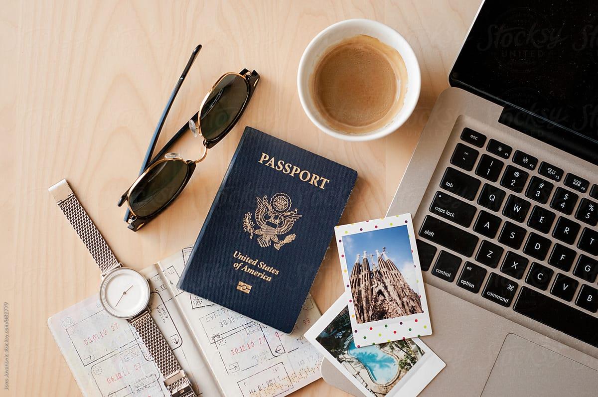 1200x797 Office desk with a laptop, passports, Polaroid picture and coffee