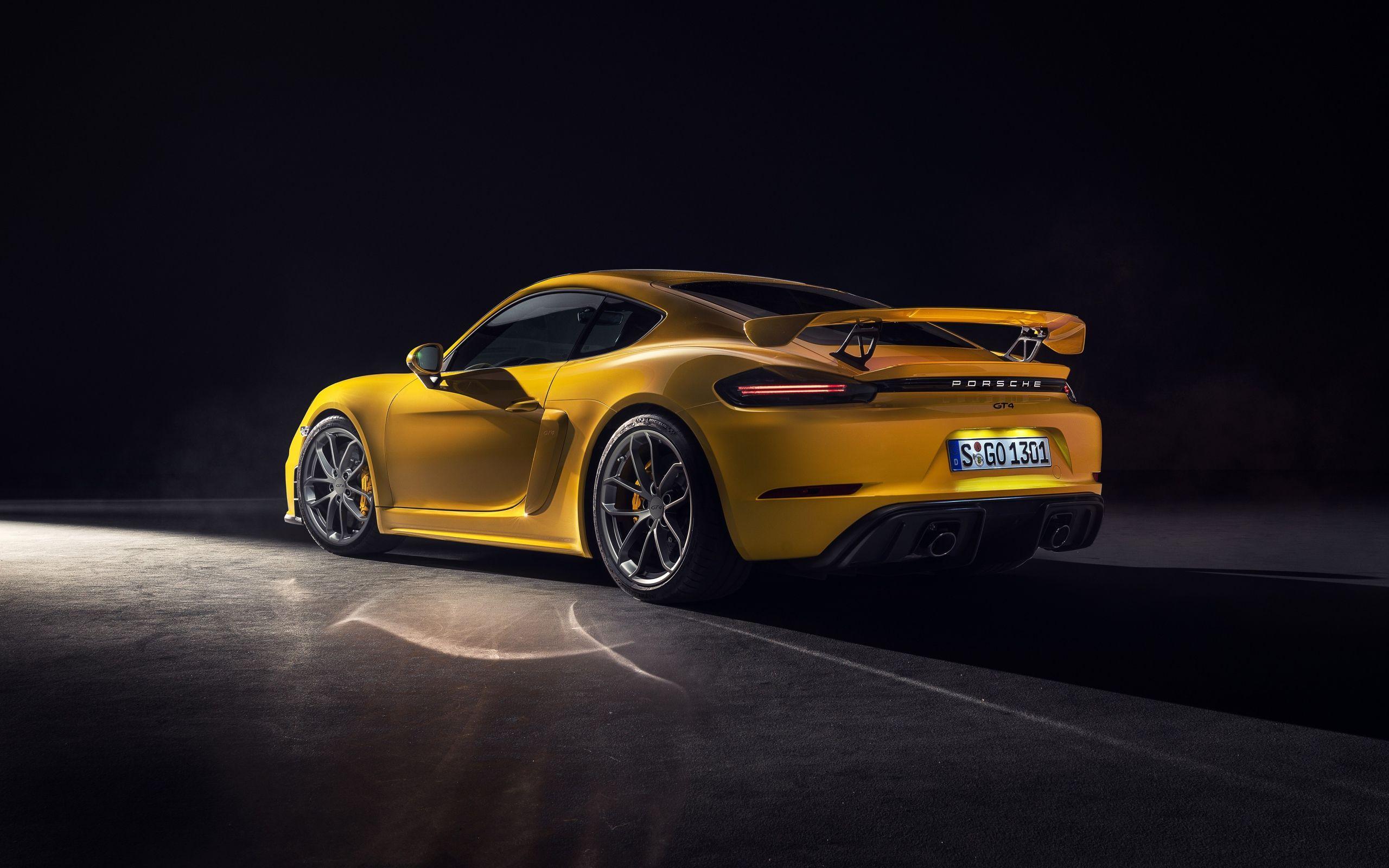 2560x1600 Yellow car Porsche 718 Cayman GT 2019 rear view Desktop wallpaper 2560x1600