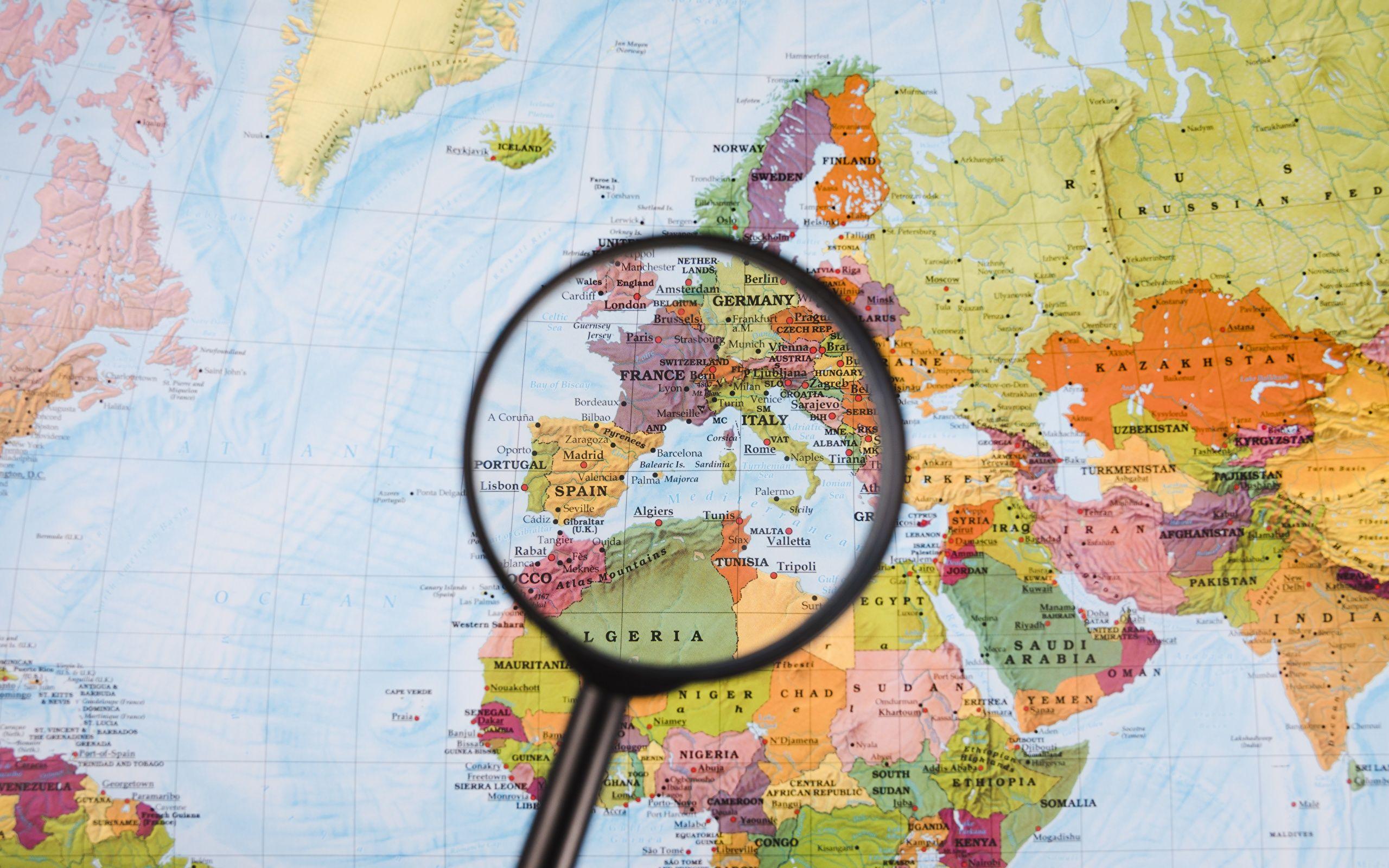 2560x1600 Image Europe Africa Magnifying glass Map Geography 2560x1600
