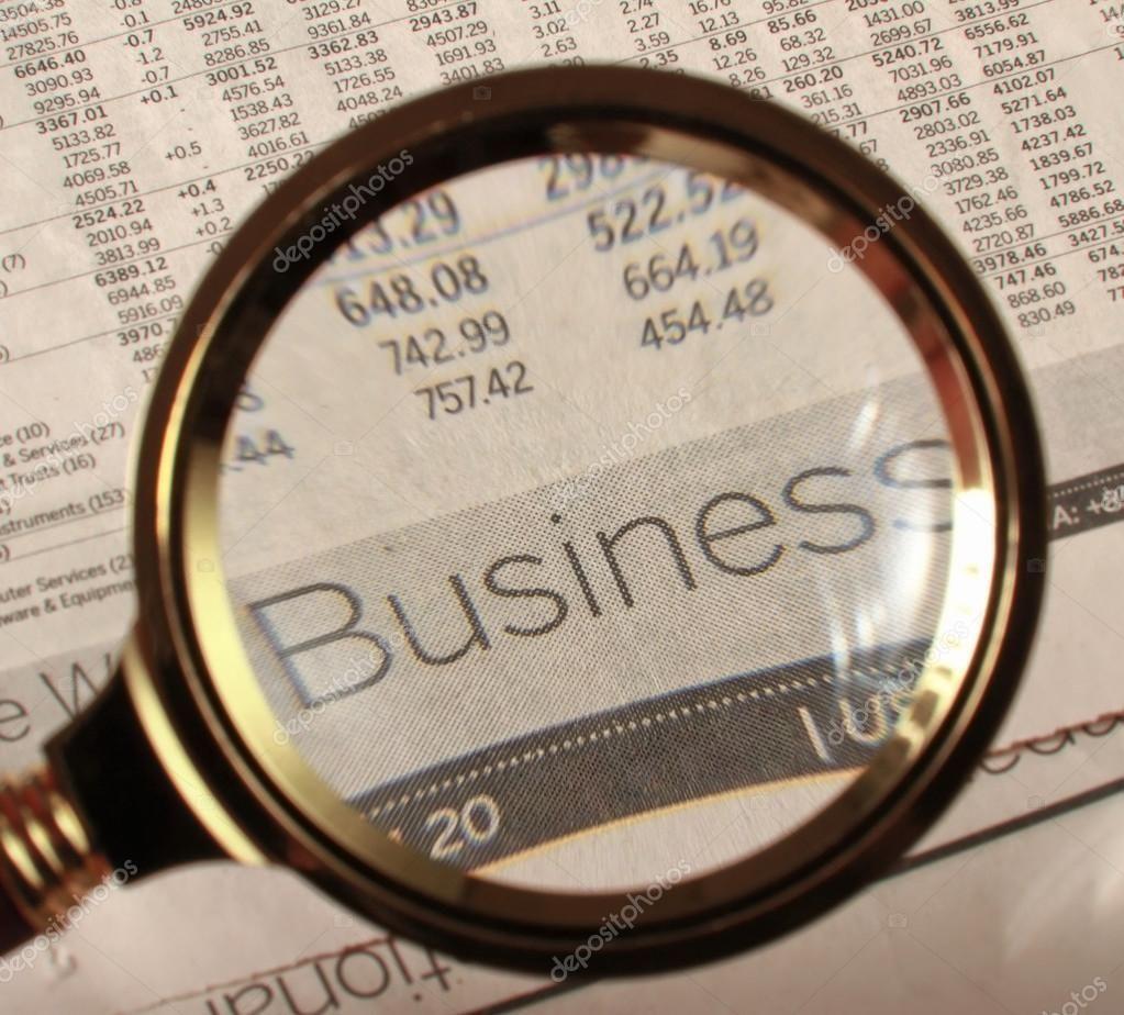 1023x924 Looking through magnifying glass to financial report