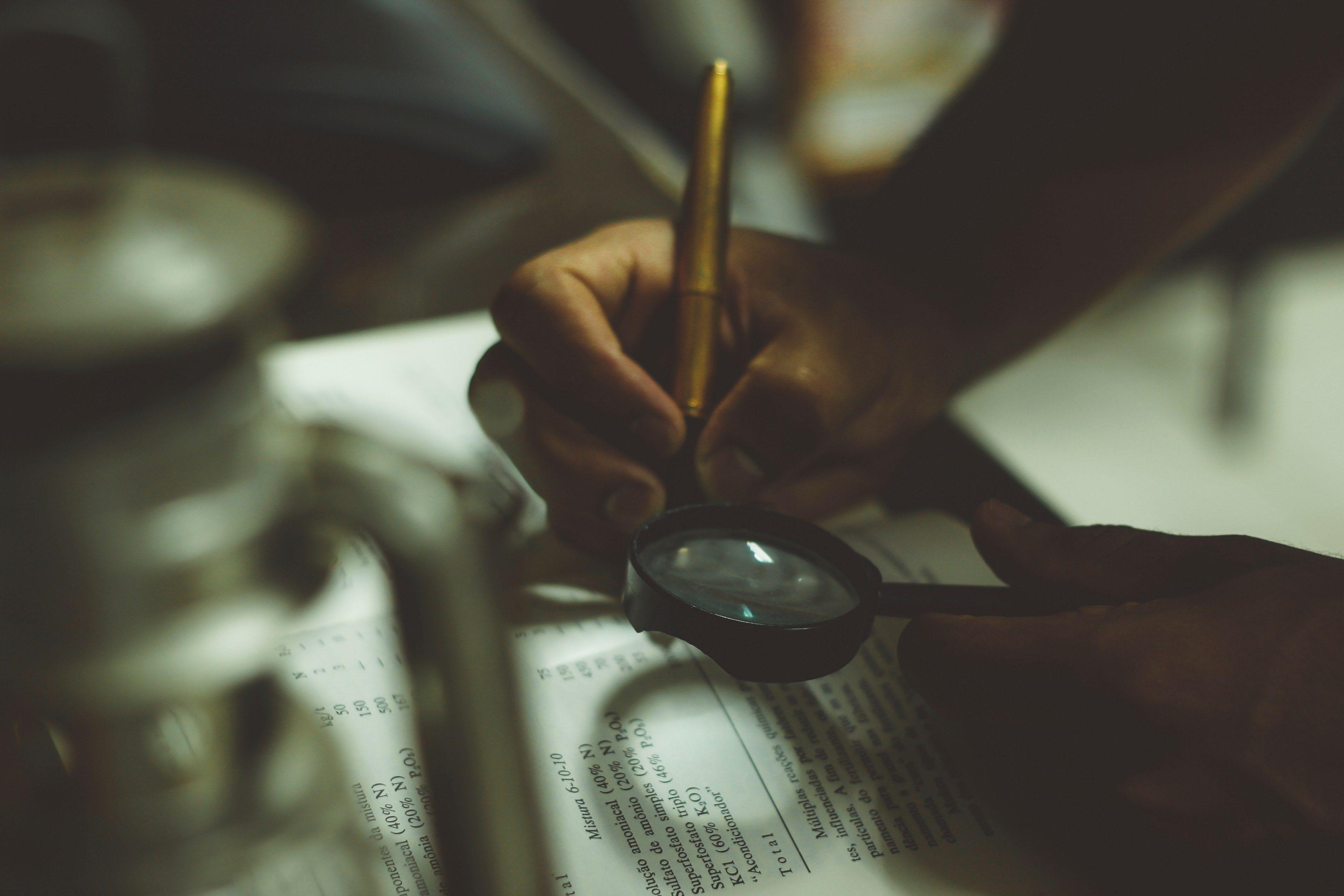 3840x2560 Wallpaper / a person reading a book with a magnifying