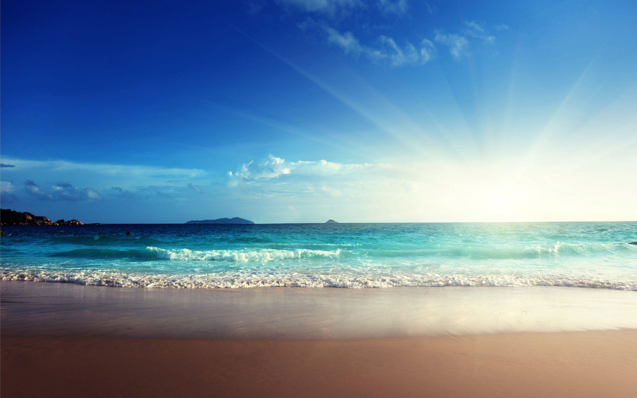 2560x1600 Sunshine emerald beach sand blue sea wallpaperx1600