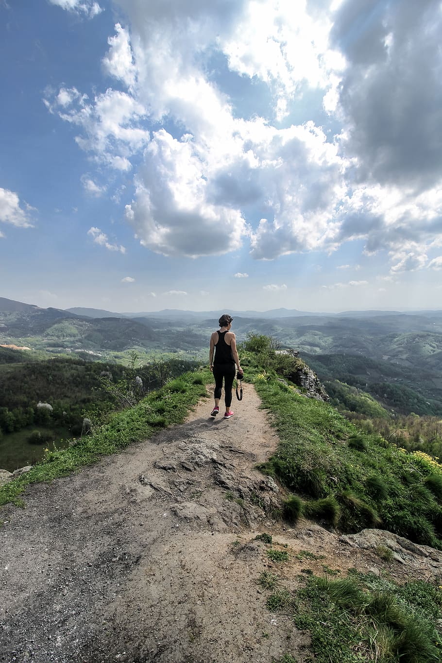 910x1365 girl, alone, rocks, mountain, high, nature, landscape, harsh