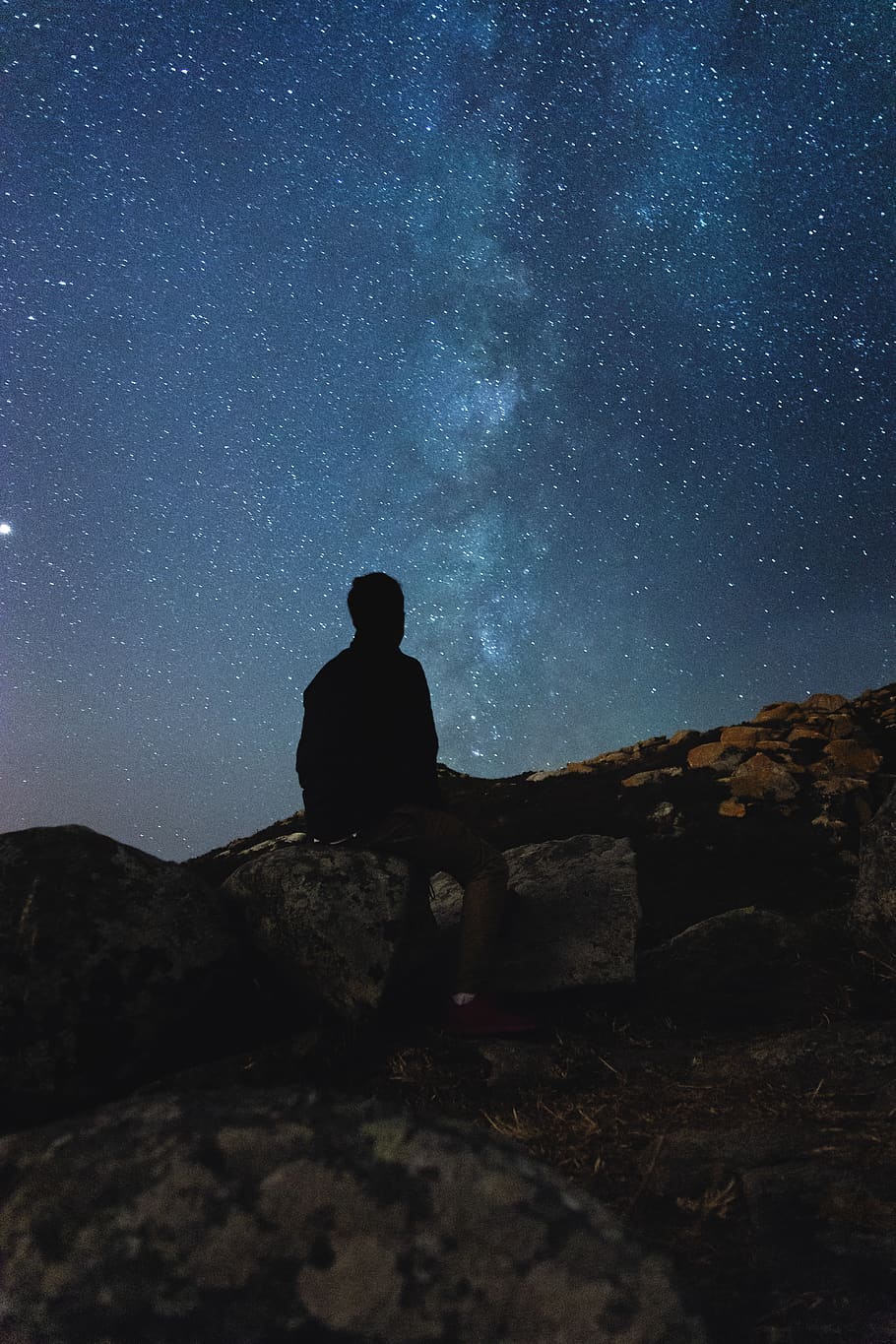 910x1365 silhouette photography, man, sitting, rock, sad, nature, nightscape, scape