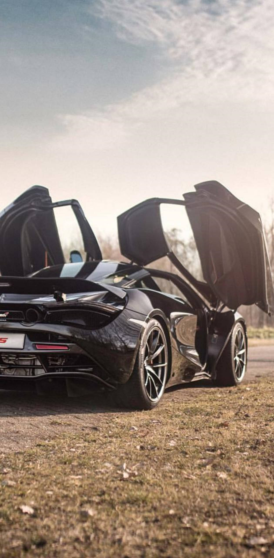 945x1920 Mclaren 720s Black Car Open Doors Phone Wallpaper