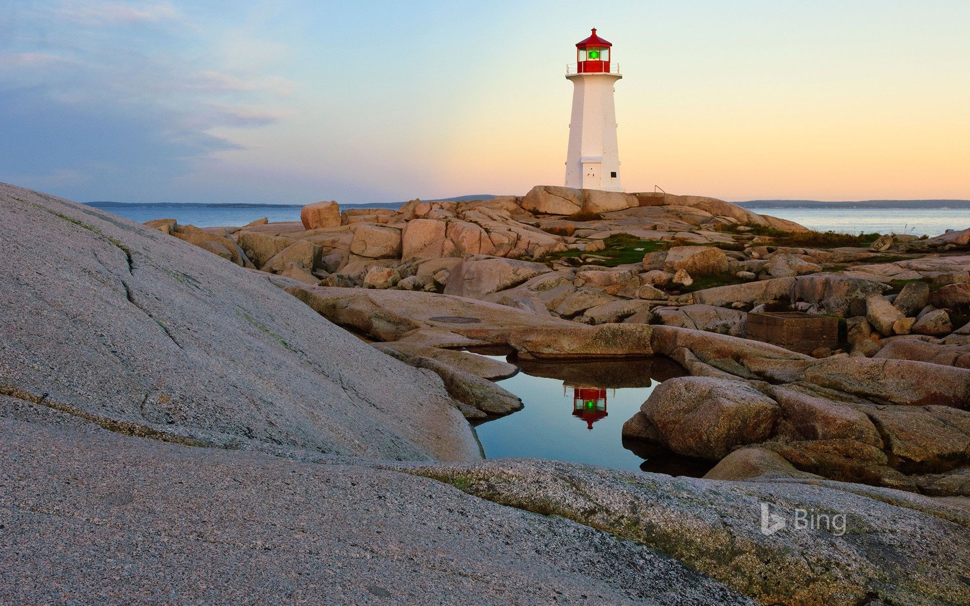 1920x1200 Lighthouse reflected in a pool of water at Peggy's Cove, Nova Scotia, Canada Wallpaper