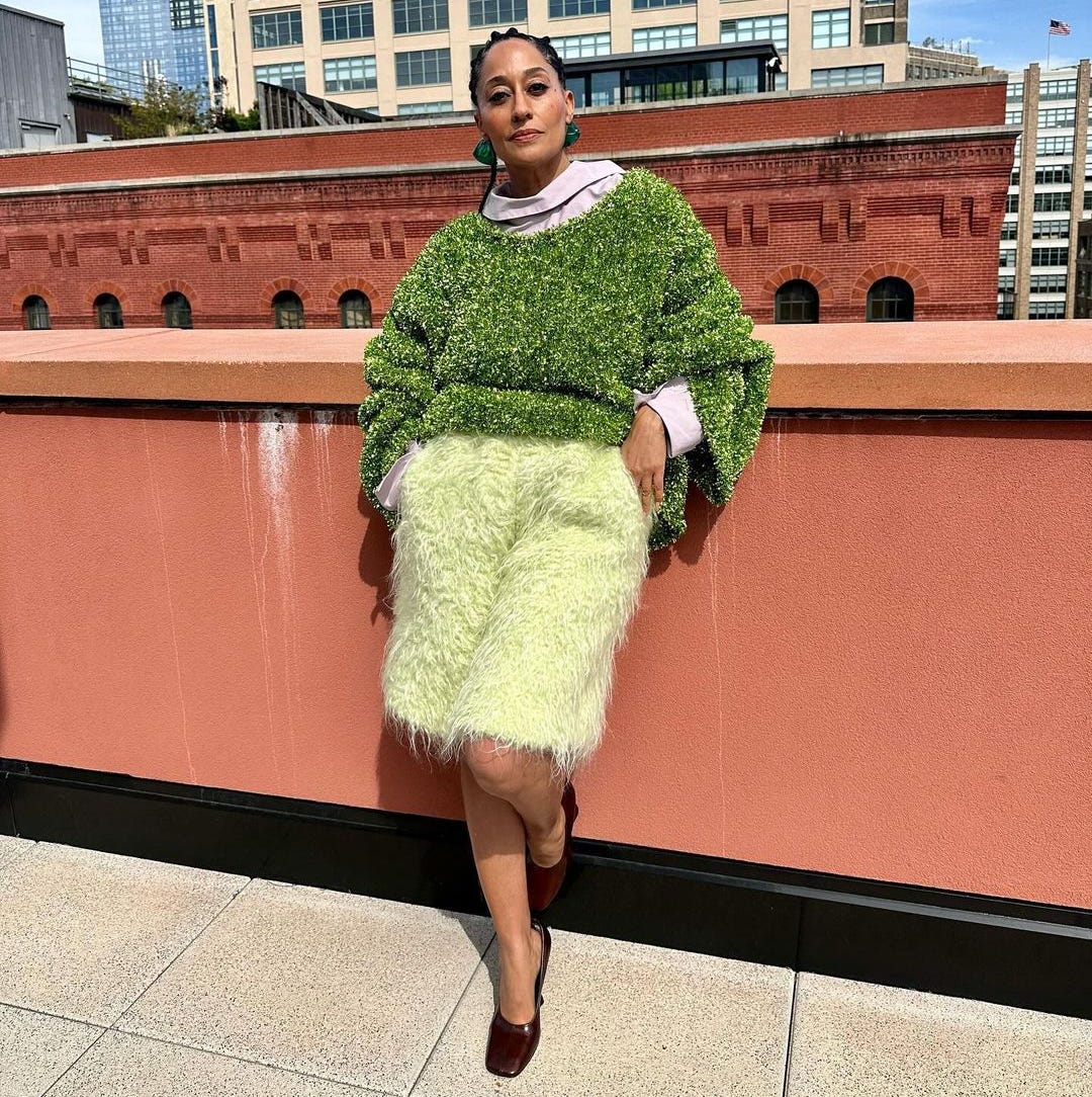 1080x1084 Tracee Ellis Ross Lets Loose in a Grassy Tinsel Sweater and Shaggy Yellow Shorts
