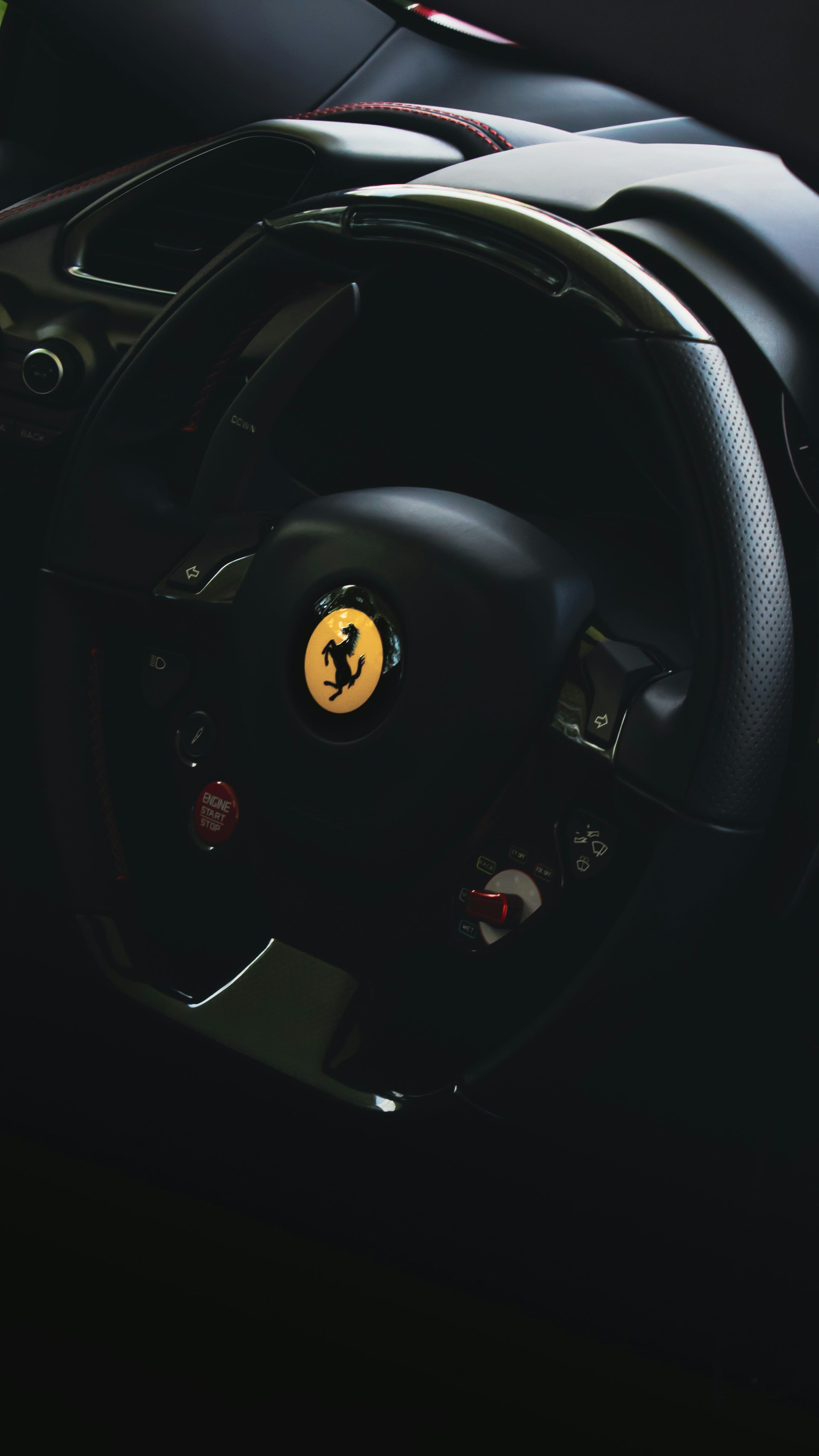 3000x5333 The steering wheel of a ferrari sports car photo