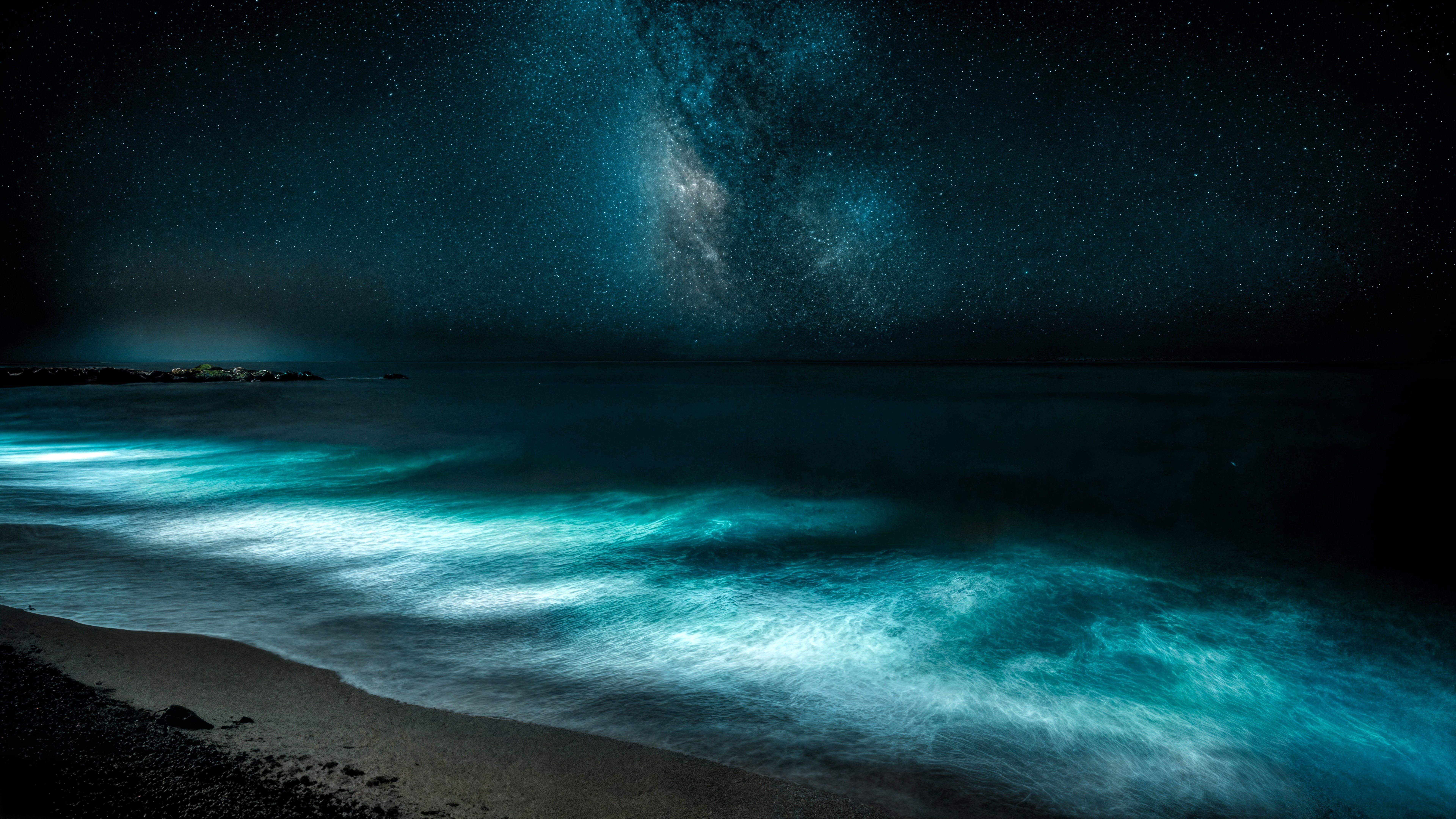 7680x4320 Bioluminescent Waves on a Night Beach and the Milky Way Wallpaper 4K for Desktop