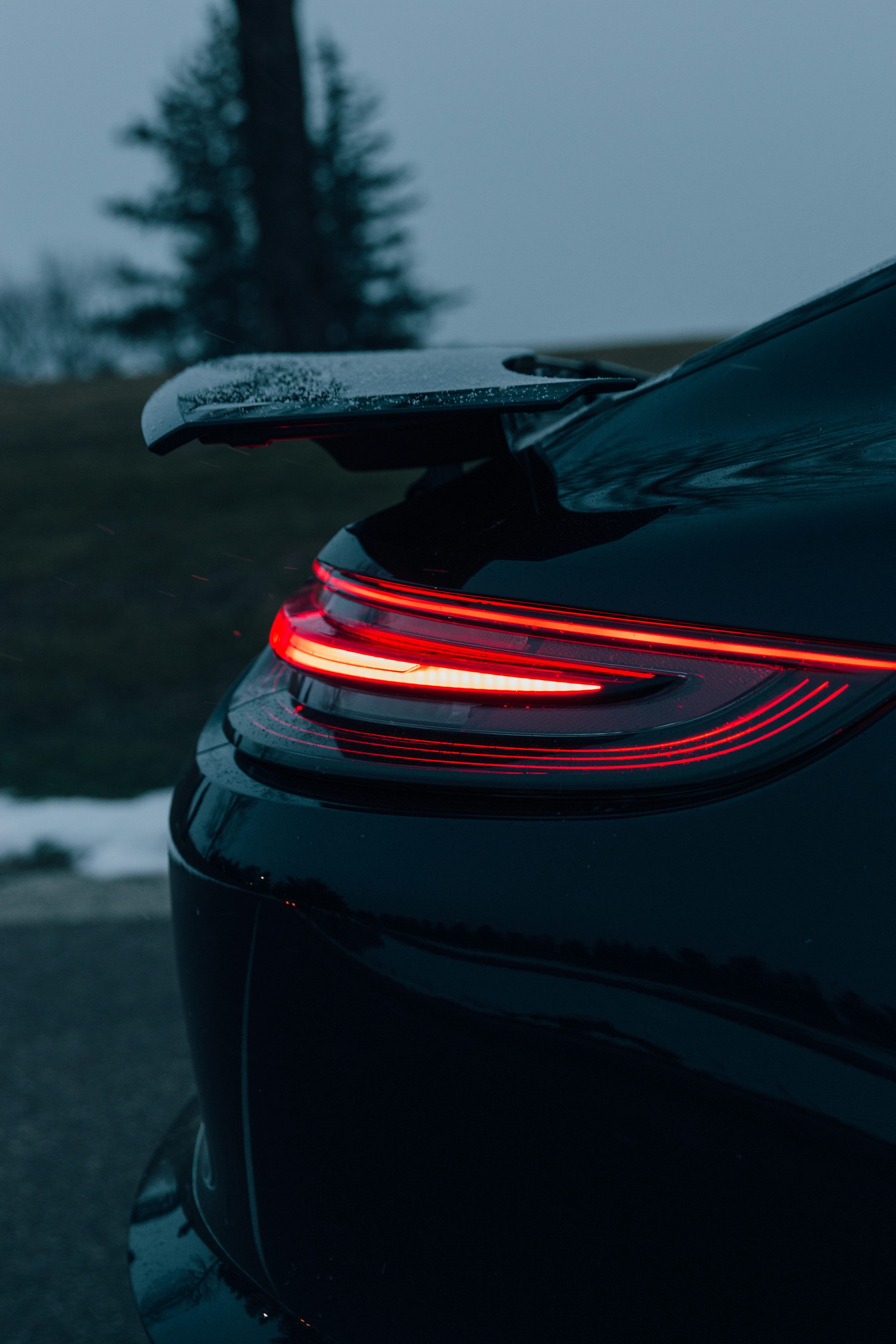 3000x4500 Black car with red and black tail light photo