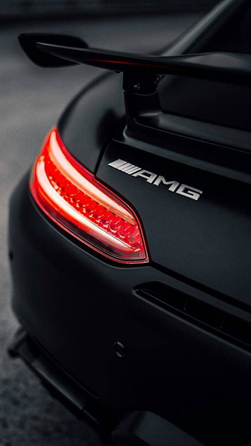800x1423 Caption: Black Amg With Glowing Red Tail Lights Wallpaper