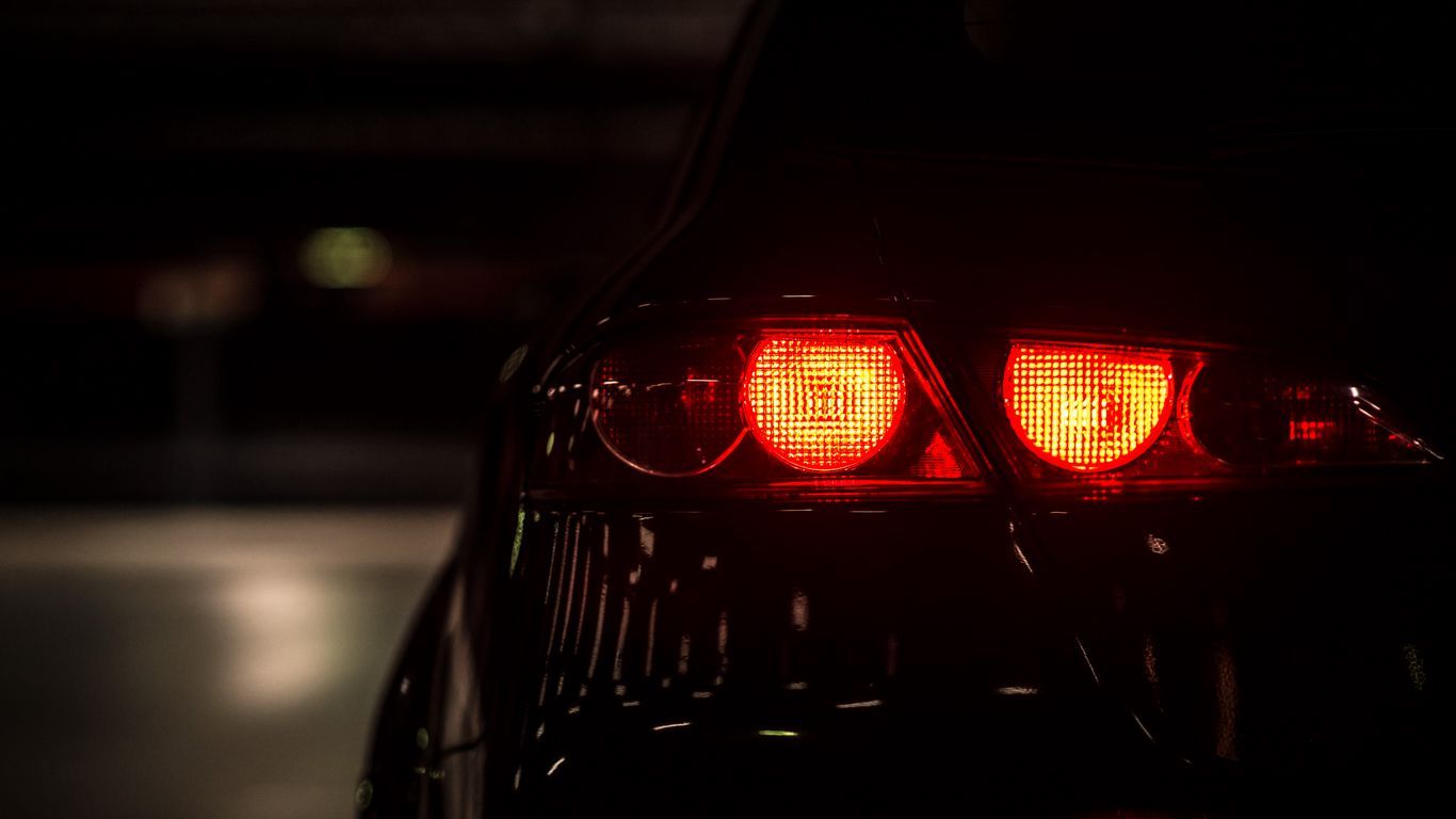 1366x768 Download wallpaper 1366x768 car, light, red, dark, backlight tablet, laptop HD background
