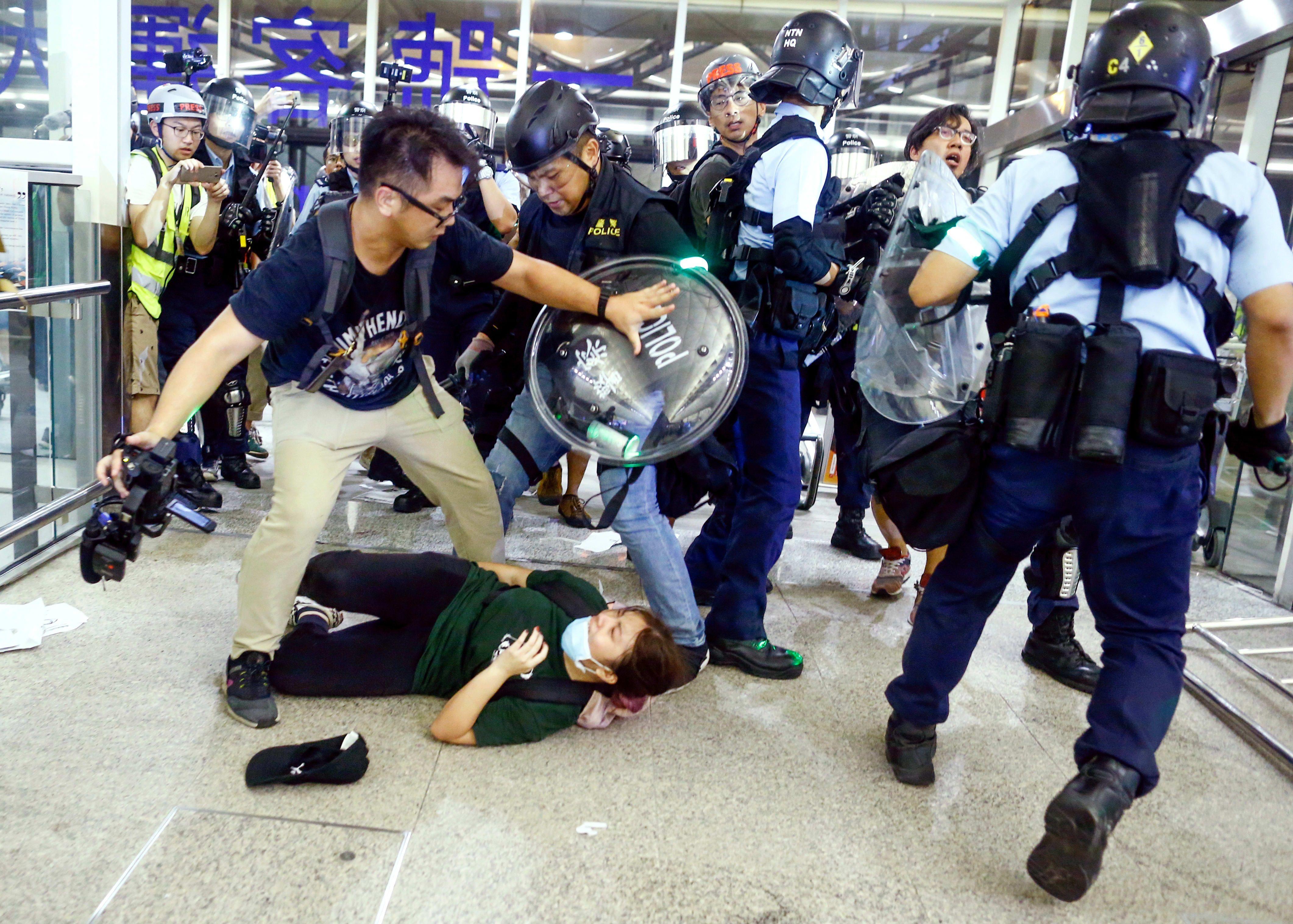 4244x3034 Hong Kong airport calm, after police clashed with protesters earlier