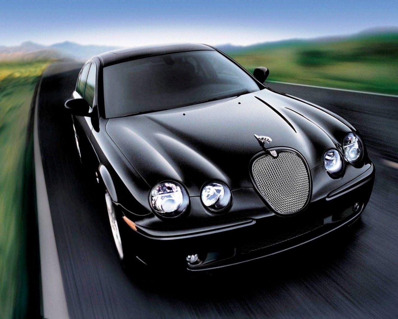1280x1024 Black Jaguar on Road