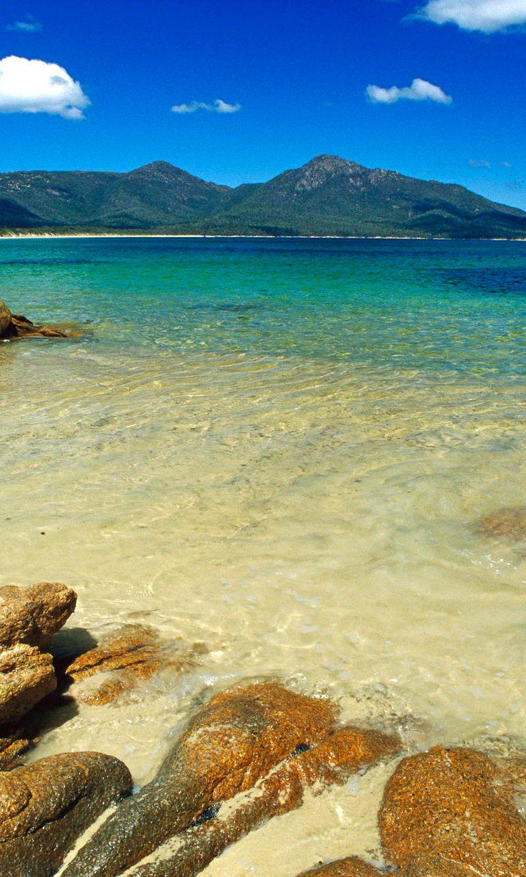 768x1280 Big rocks on the beach wallpaper