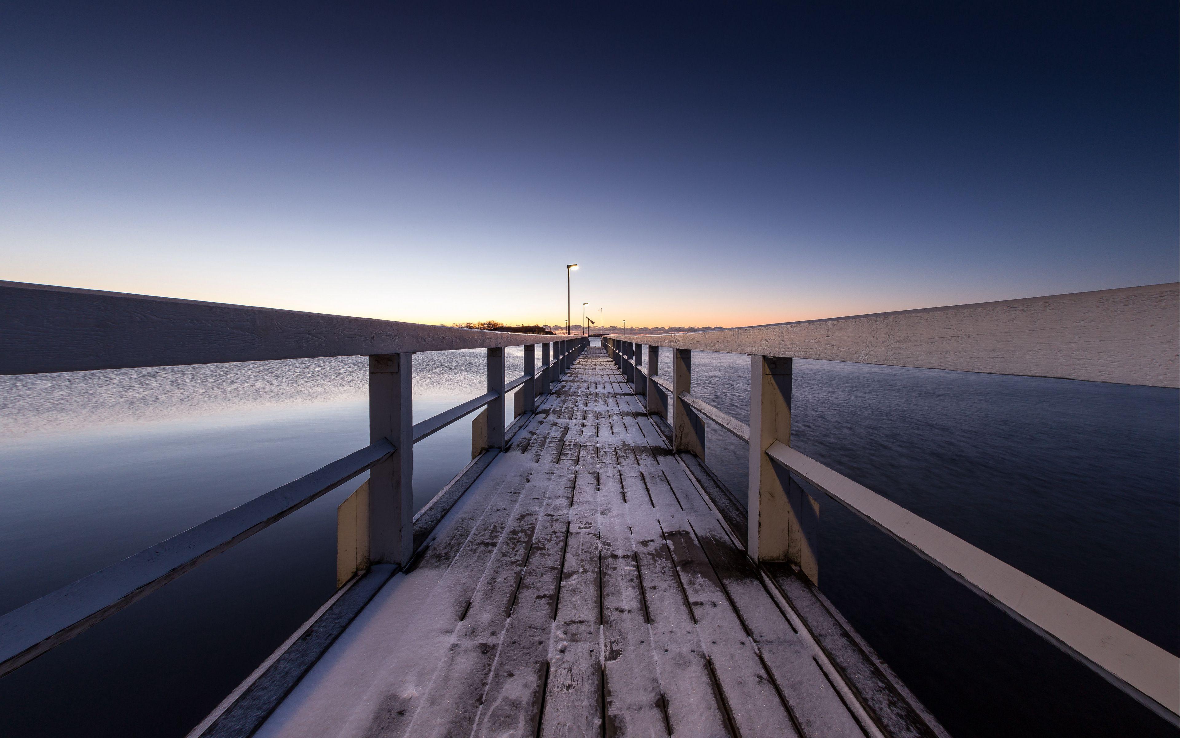 3840x2400 Download wallpaper 3840x2400 pier, snow, bridge, sunset, helsinki, finland 4k ultra HD 16:10 HD background