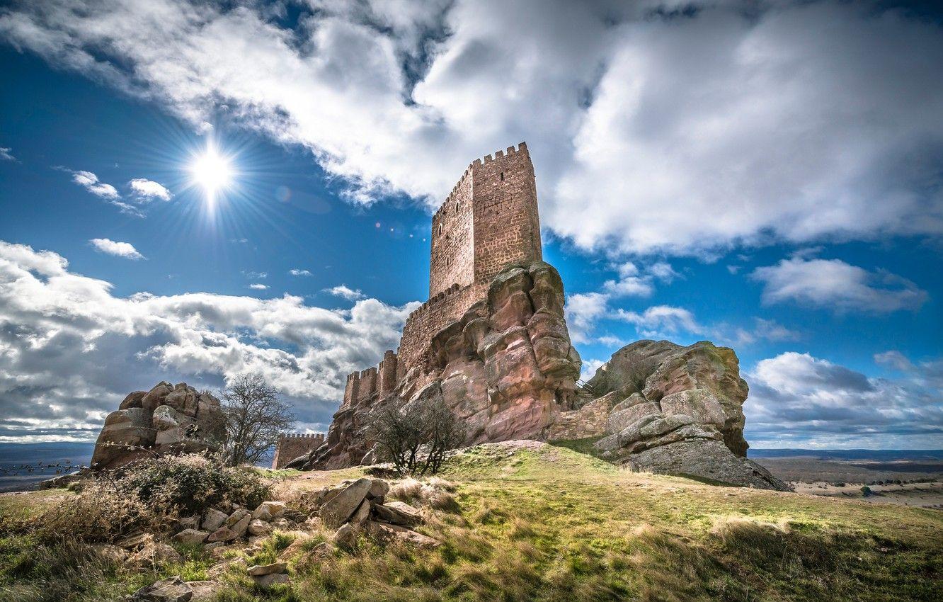 1332x850 Wallpaper the sky, grass, the sun, clouds, rays, stones, castle, wall, hill, fortress, Spain, Guadalajara, ranina, Castle of Zafra image for desktop, section пейзажи