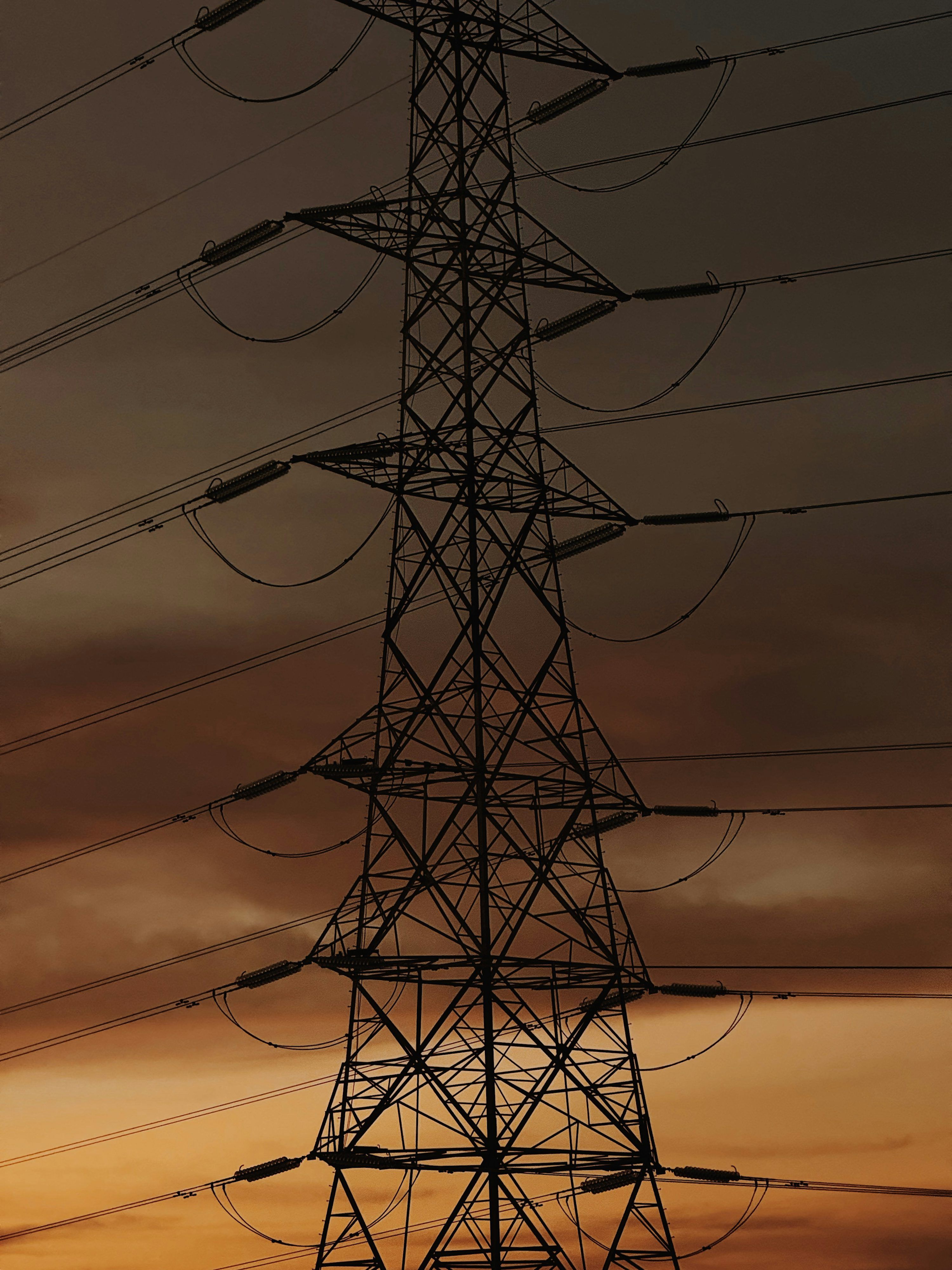 3000x4000 Silhouette of a power line tower against sunset sky photo