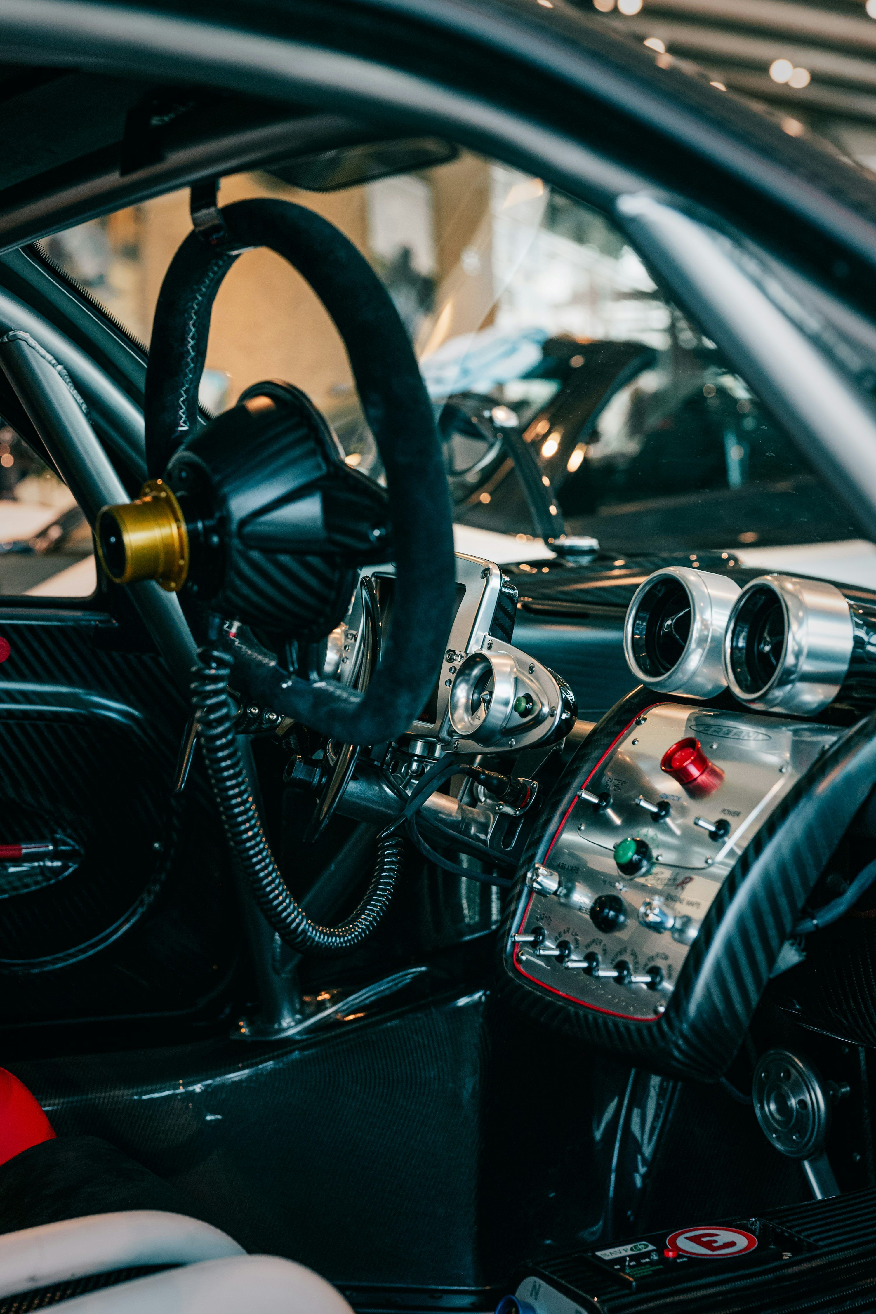 3000x4500 The interior of a car with a steering wheel and dashboard photo
