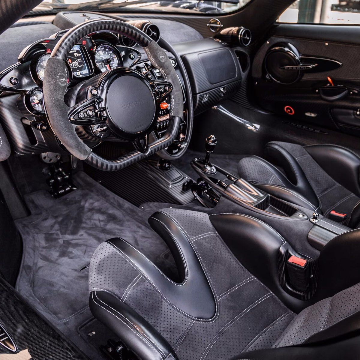 1200x1200 Pagani Huayra BC Coupe of 20 produced The exterior is a stunning contrast of exposed Blu Tricolore and Black Mamba carbon fiber with yellow and blue signature BC stripes