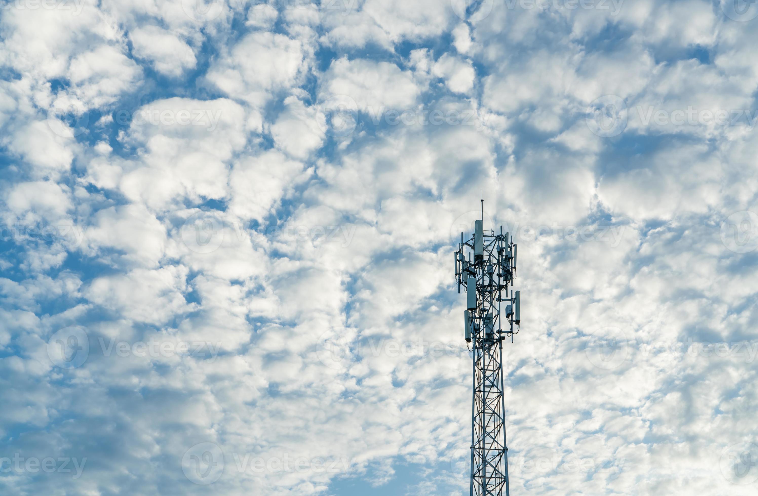 2993x1960 Telecommunication tower with blue sky and white clouds background. Antenna on blue sky. Radio and satellite pole. Communication technology. Telecommunication industry. Mobile or telecom 4g network
