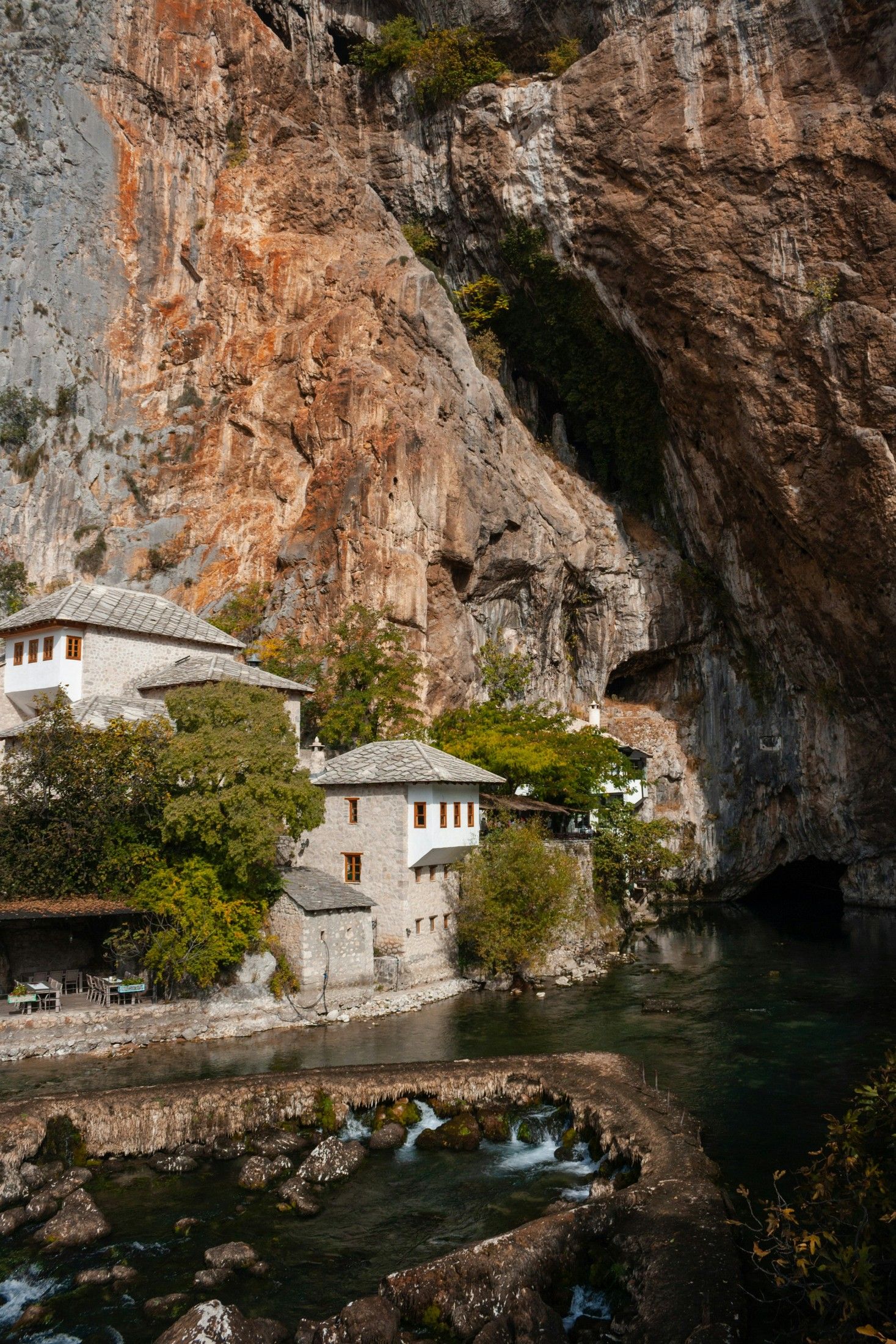 1467x2200 Blagaj riverside cave with a house to match