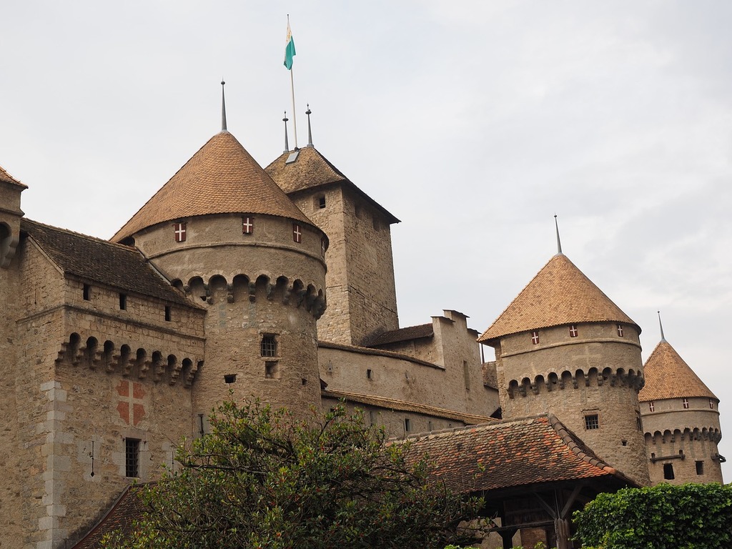 1024x768 Chillon castle chillon building. A castle with a flag on