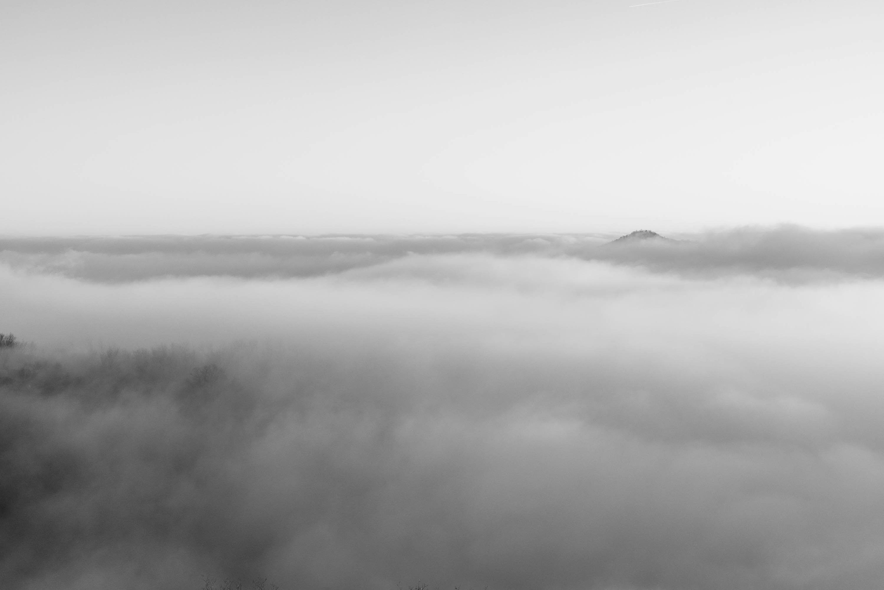 3000x2001 A black and white photo of a foggy landscape photo