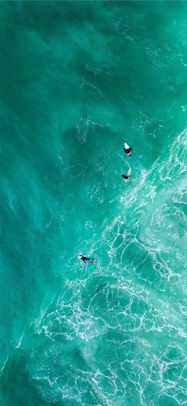 640x1385 aerial photography of surfers on sea iPhone X Wallpaper Free Download