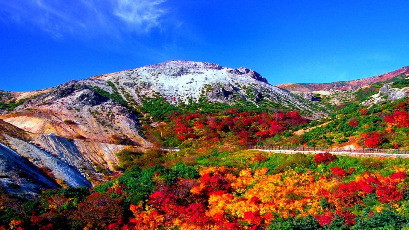 1366x768 Mountain: Road Scene Fence Mountain Autumn Rocky Mountains Wallpaper HD 16:9 High Definition 1080p 4k 900p 720p. Natural landmarks, Colorful landscape, Mountains