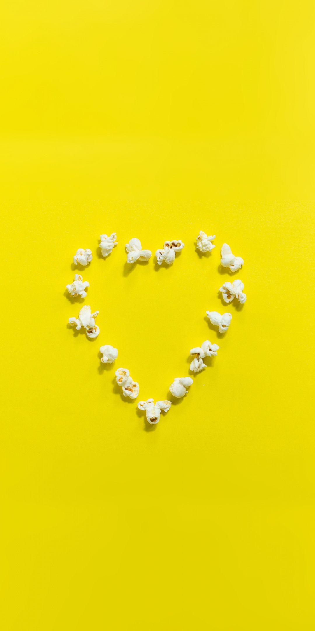 1080x2160 Popcorn, heart shape, yellow background, minimal, 1080x2160 wallpaper. Heart shapes, Yellow background, Popcorn times