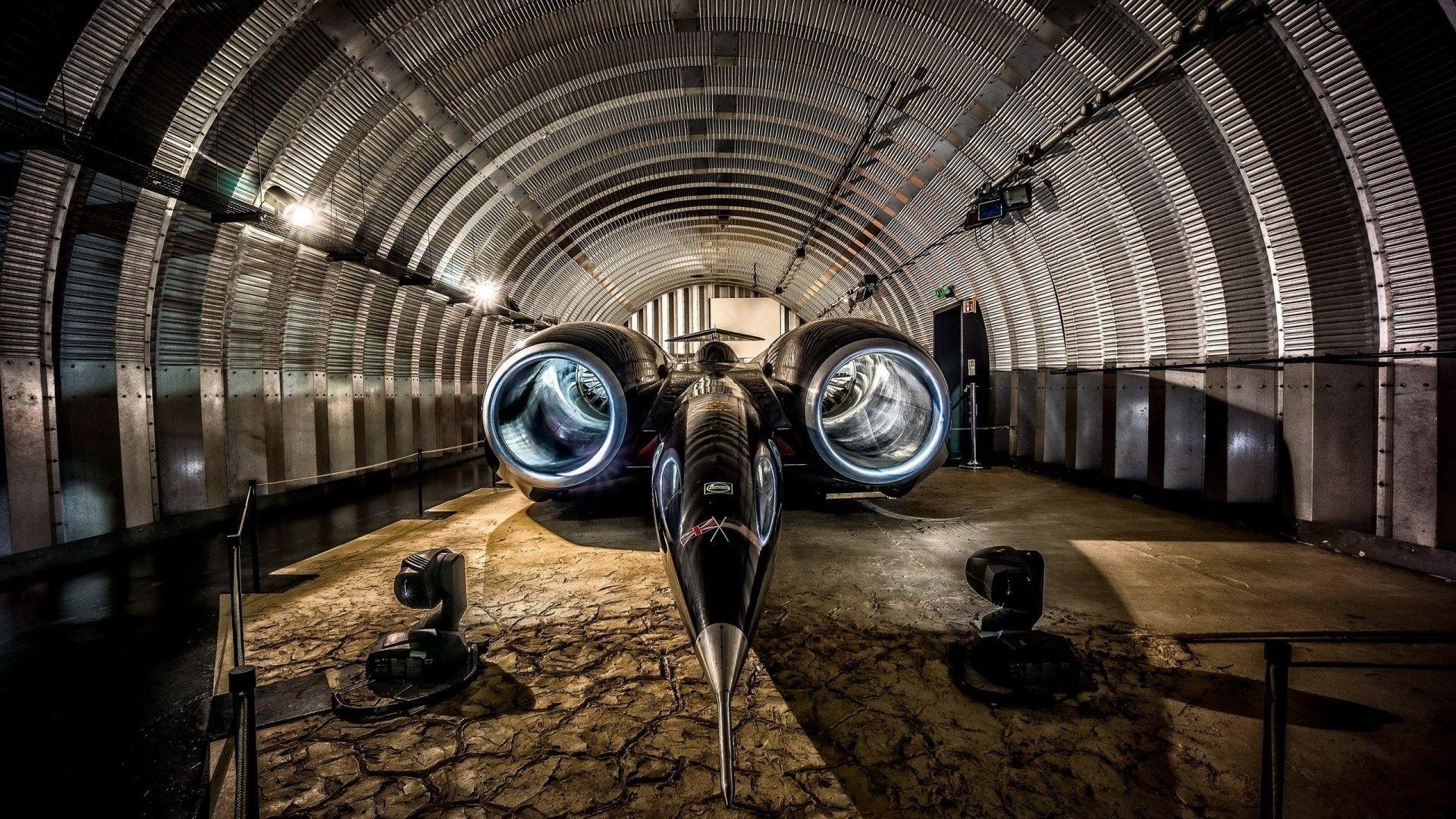 1920x1080 #technology, #HDR, #British cars, #supersonic, #Thrust SSC, #hangar, #lights, #garages, #rocket, #vehicle, #turbines, #car, #jet car, wallpaper. Mocah.org HD Wallpaper