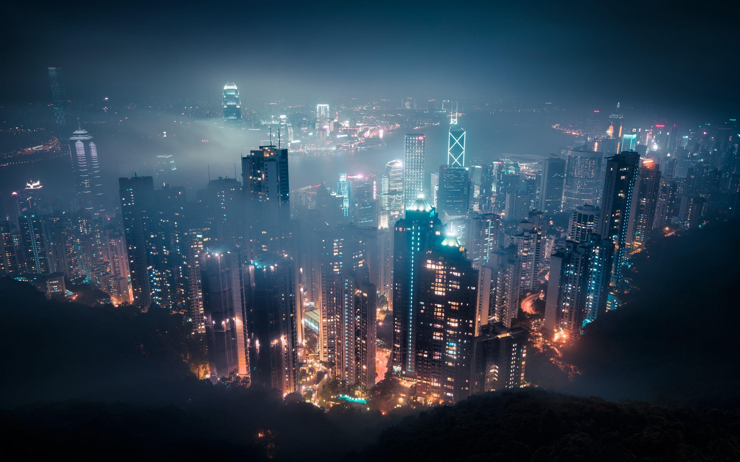 Premium Photo | Panoramic view of hong kong from the top point (victoria  peak). night with the glow of the city lights and the light show