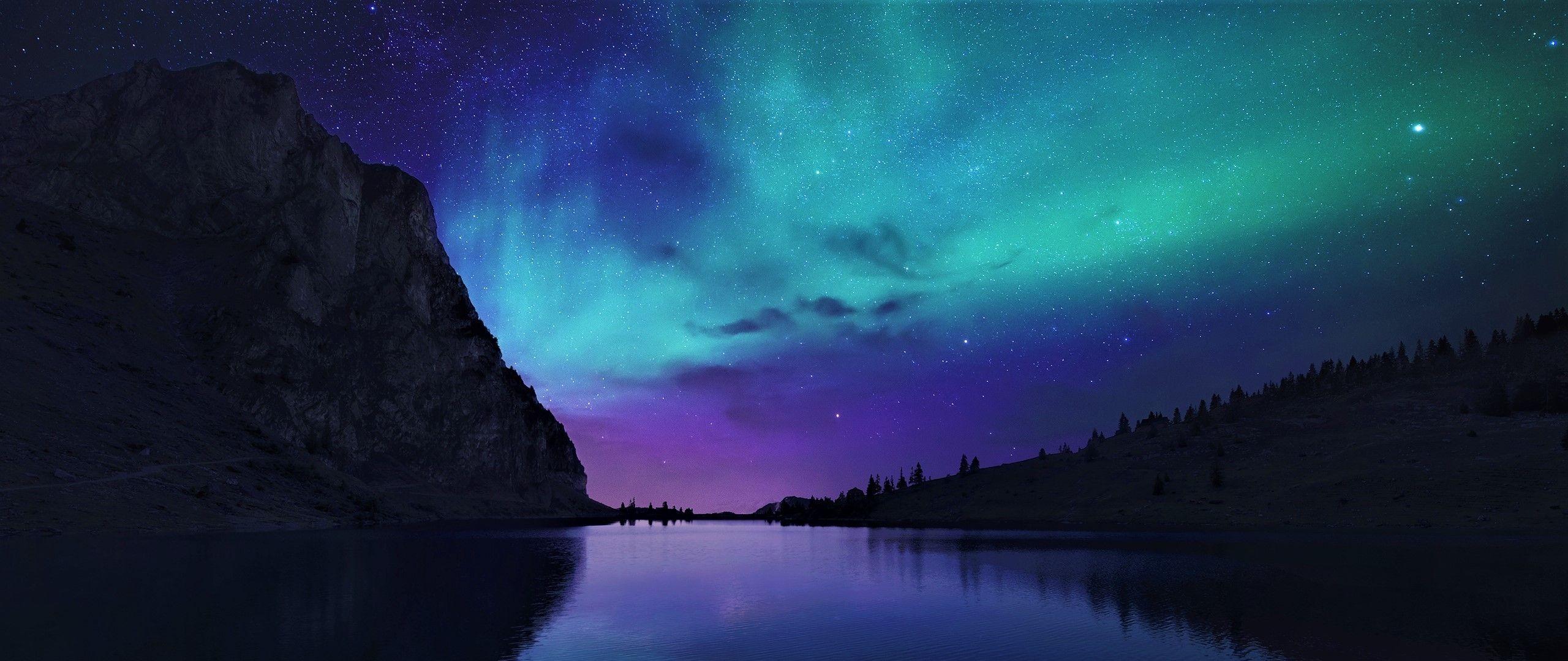 2560x1080 Aurora Borealis Northern Lights Over Mountain Lake 2560x1080 Resolution Wallpaper, HD Nature 4K Wallpaper, Image, Photo and Background