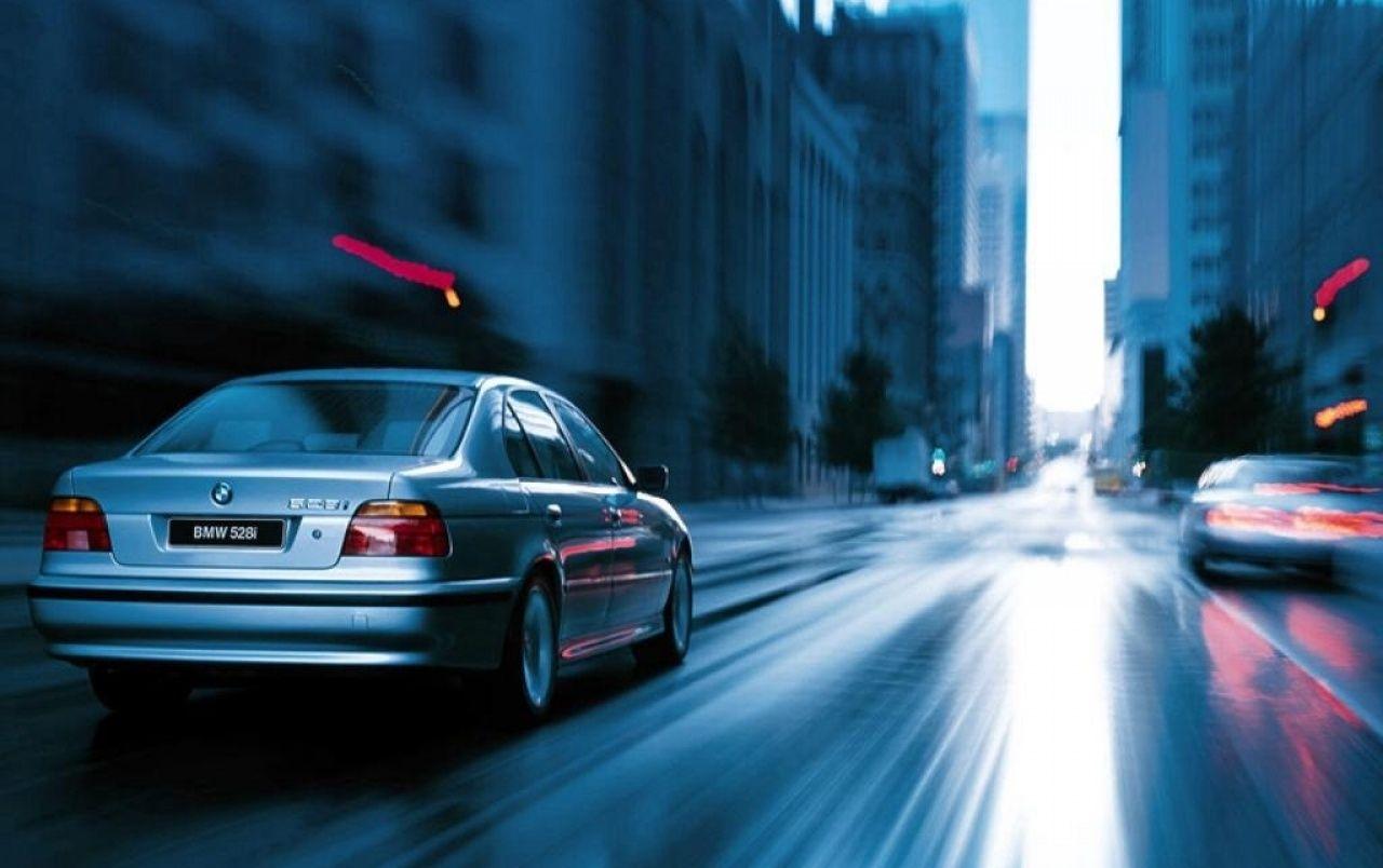 1280x804 BMW 528i in town wallpaper. BMW 528i in town