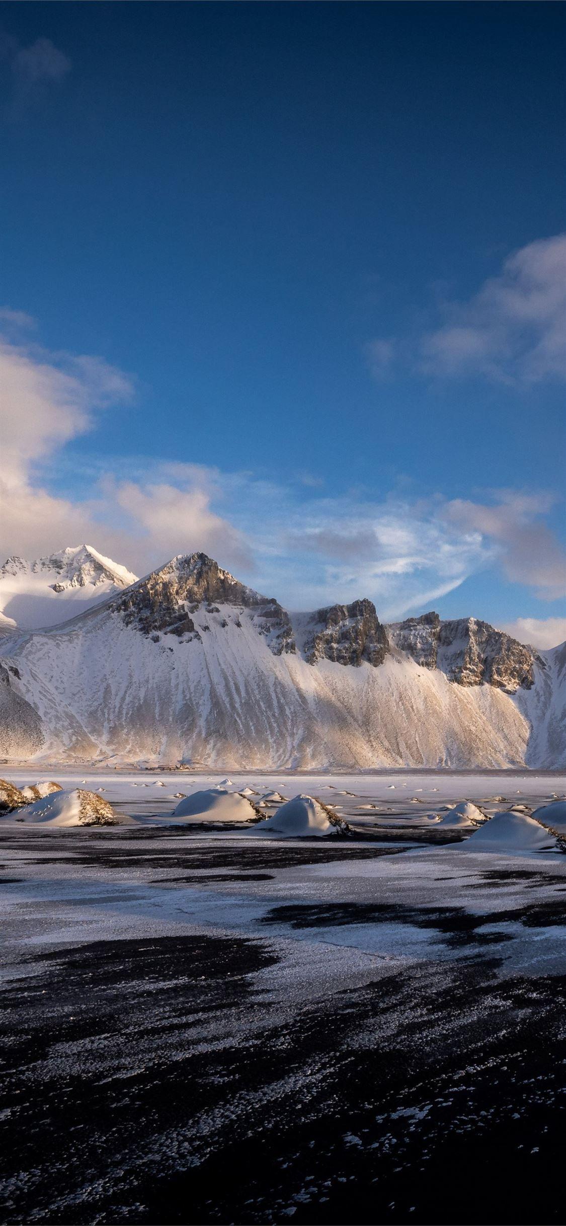1125x2436 hofn vestrahorn clouds iceland mountains 4k iPhone 11 Wallpaper Free Download