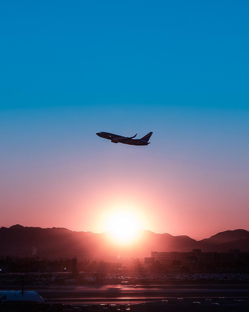 864x1080 ITAP of a plane taking off during sunrise