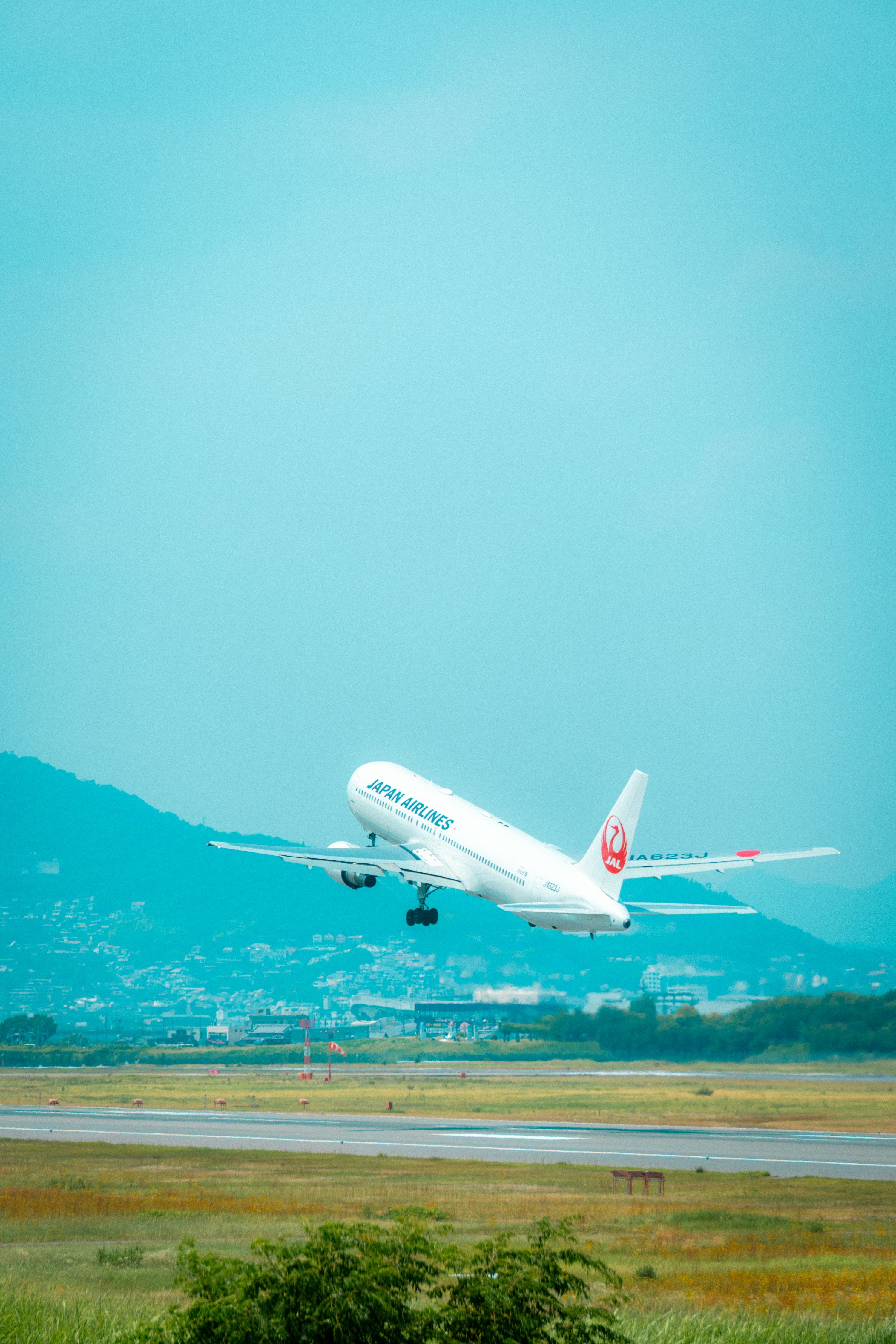 3000x4500 A japan airlines plane takes off from the runway. photo