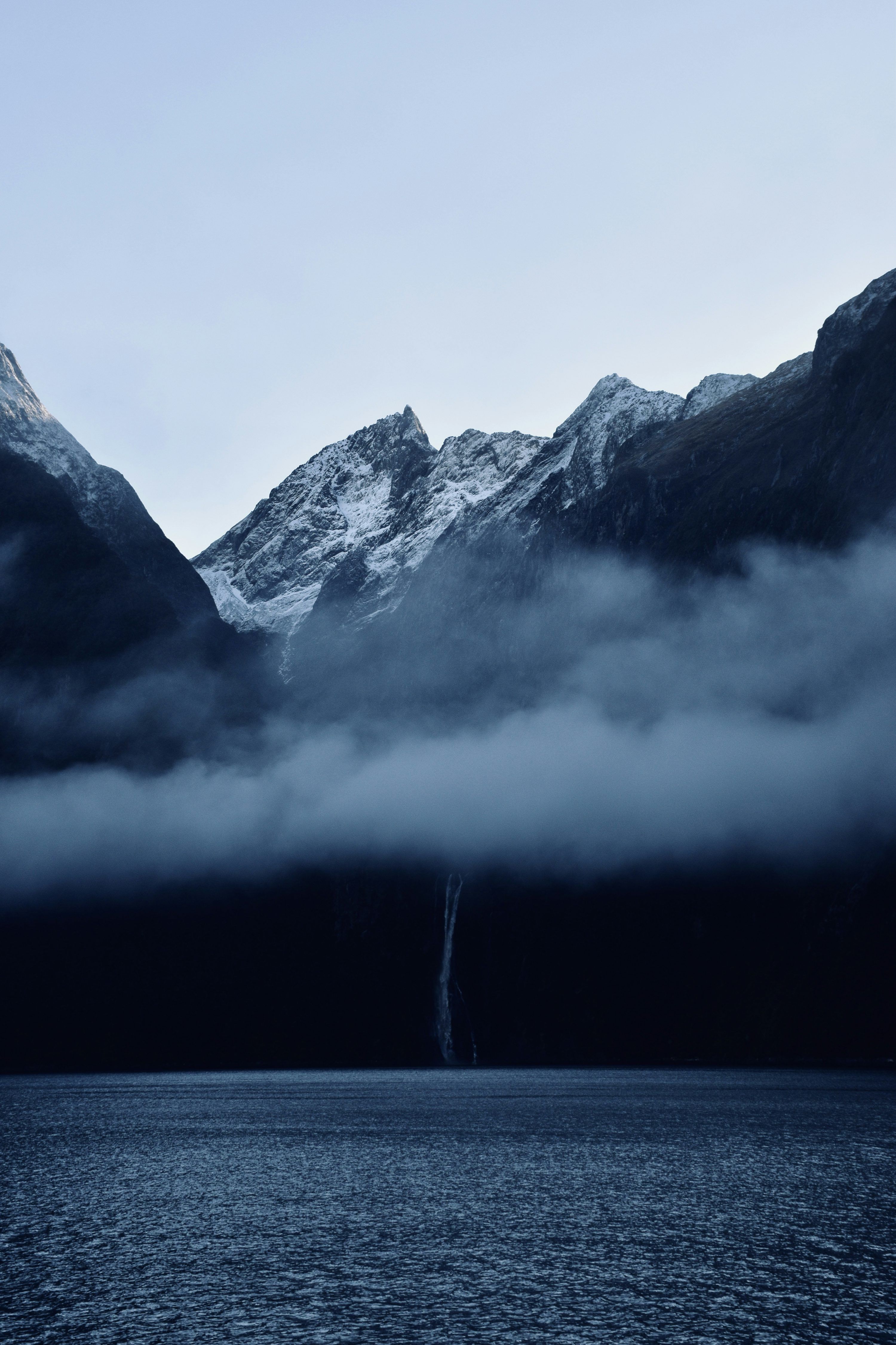 3000x4501 Black and white mountain near body of water photo