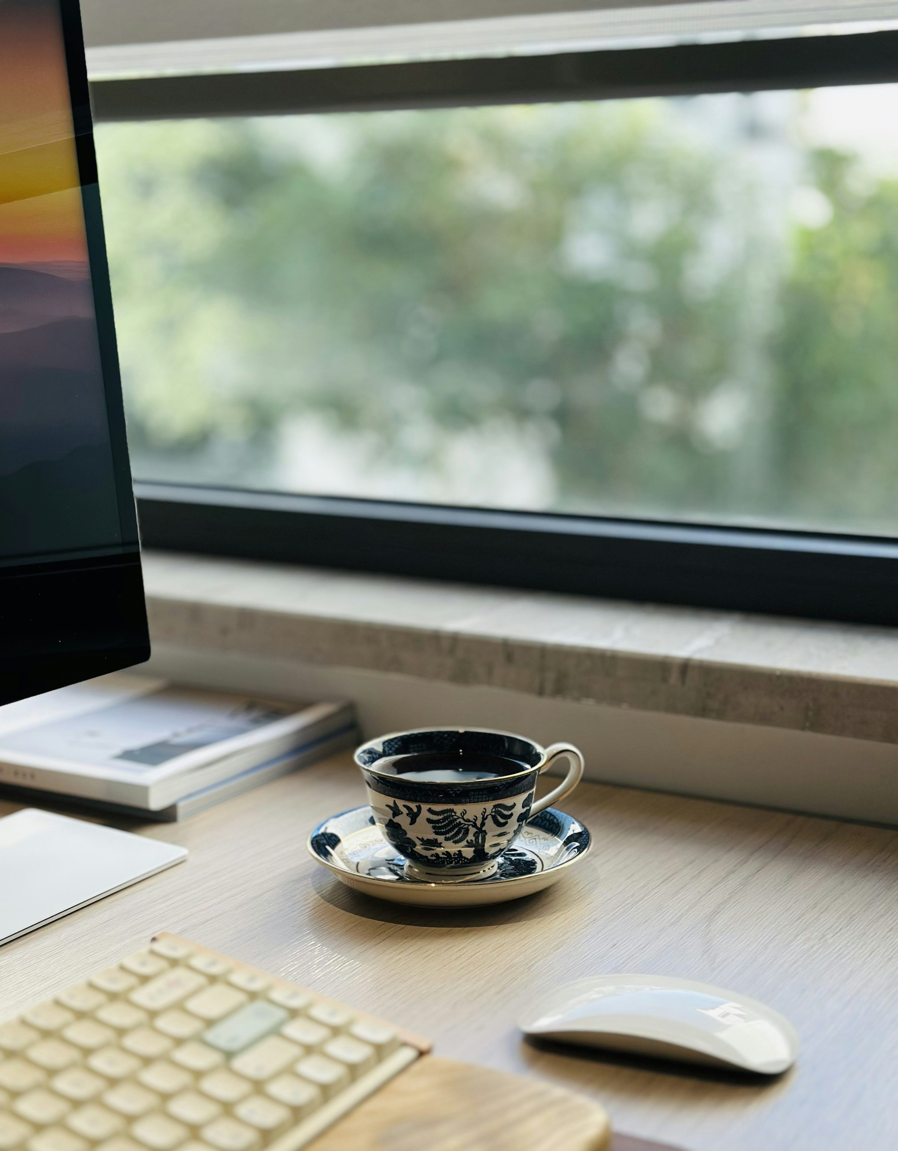 3000x3846 A cup of coffee on a desk by the window. photo