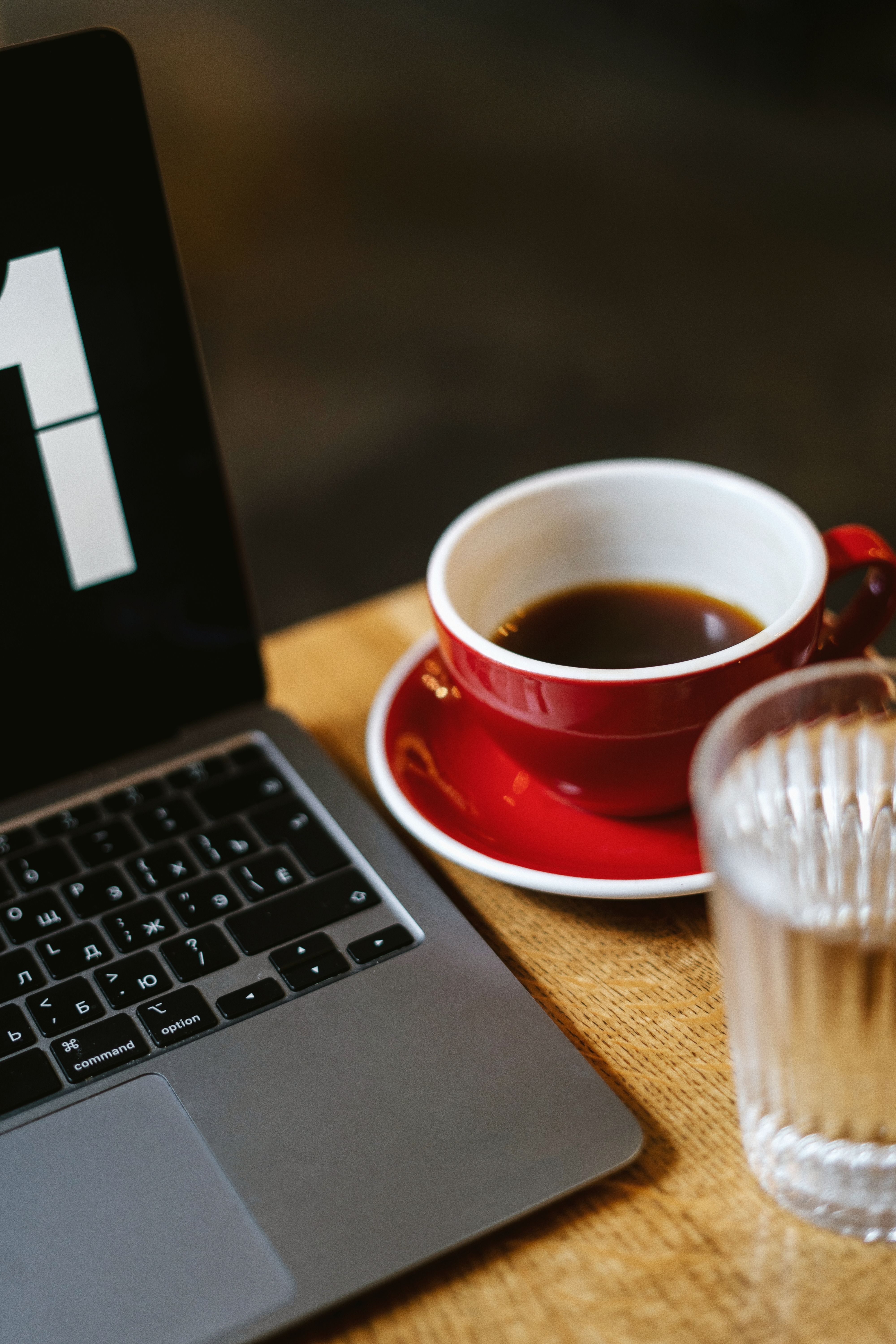 4000x6000 A Cup of Coffee Near a Laptop · Free