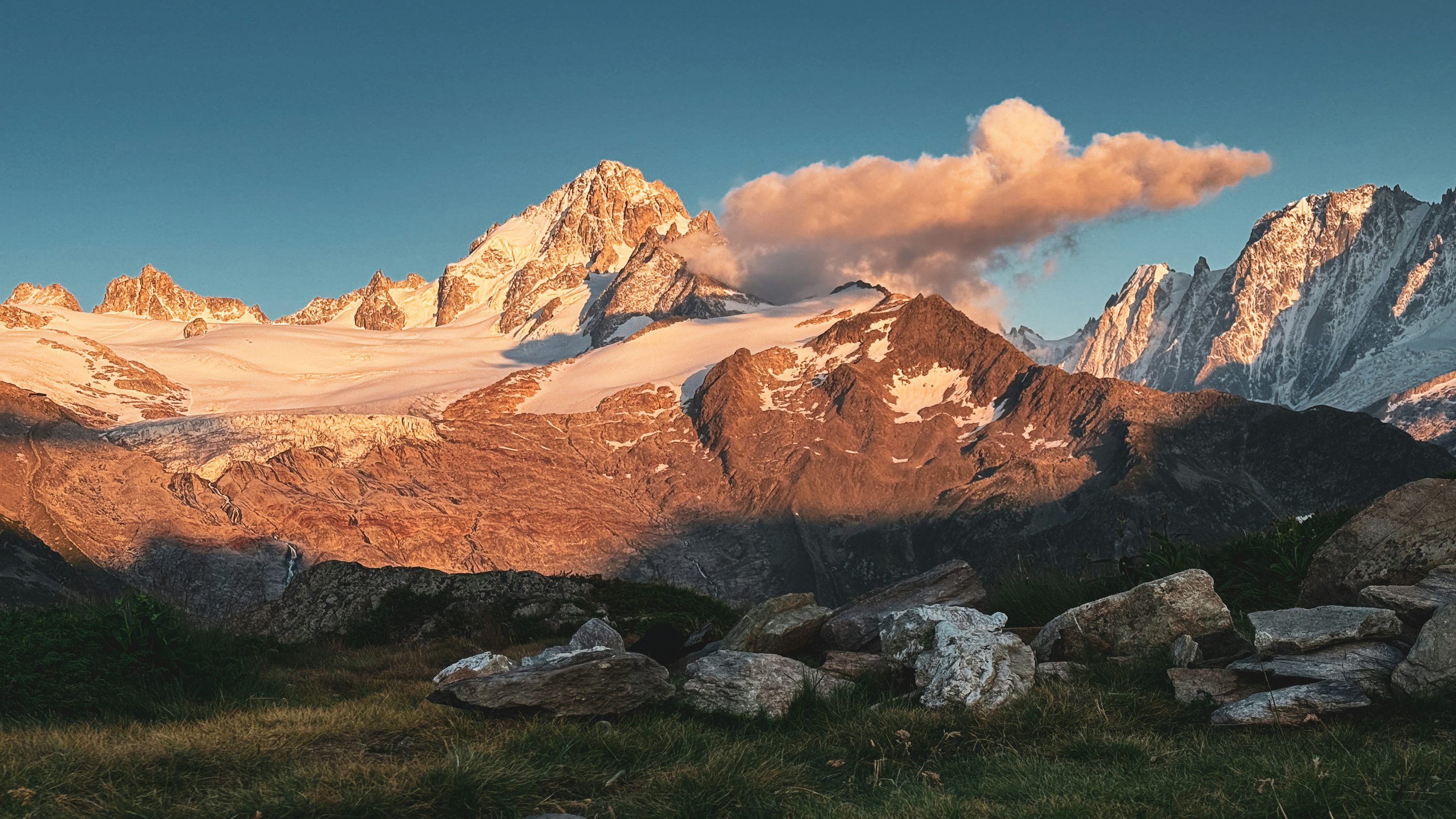 3000x1688 Majestic mountains bask in the morning sunlight. photo