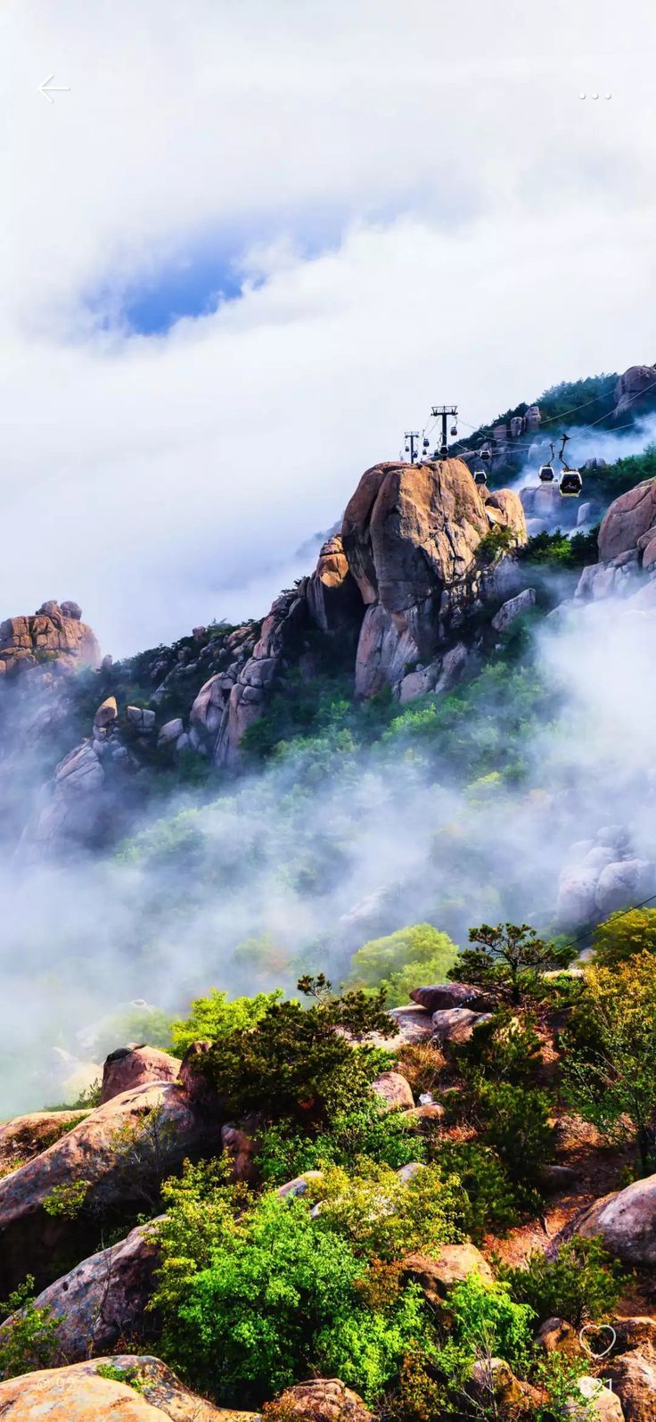 736x1594 Majestic Mountains Covered in Fog and Clouds. Aerial view mountain scenery, River running through mountains