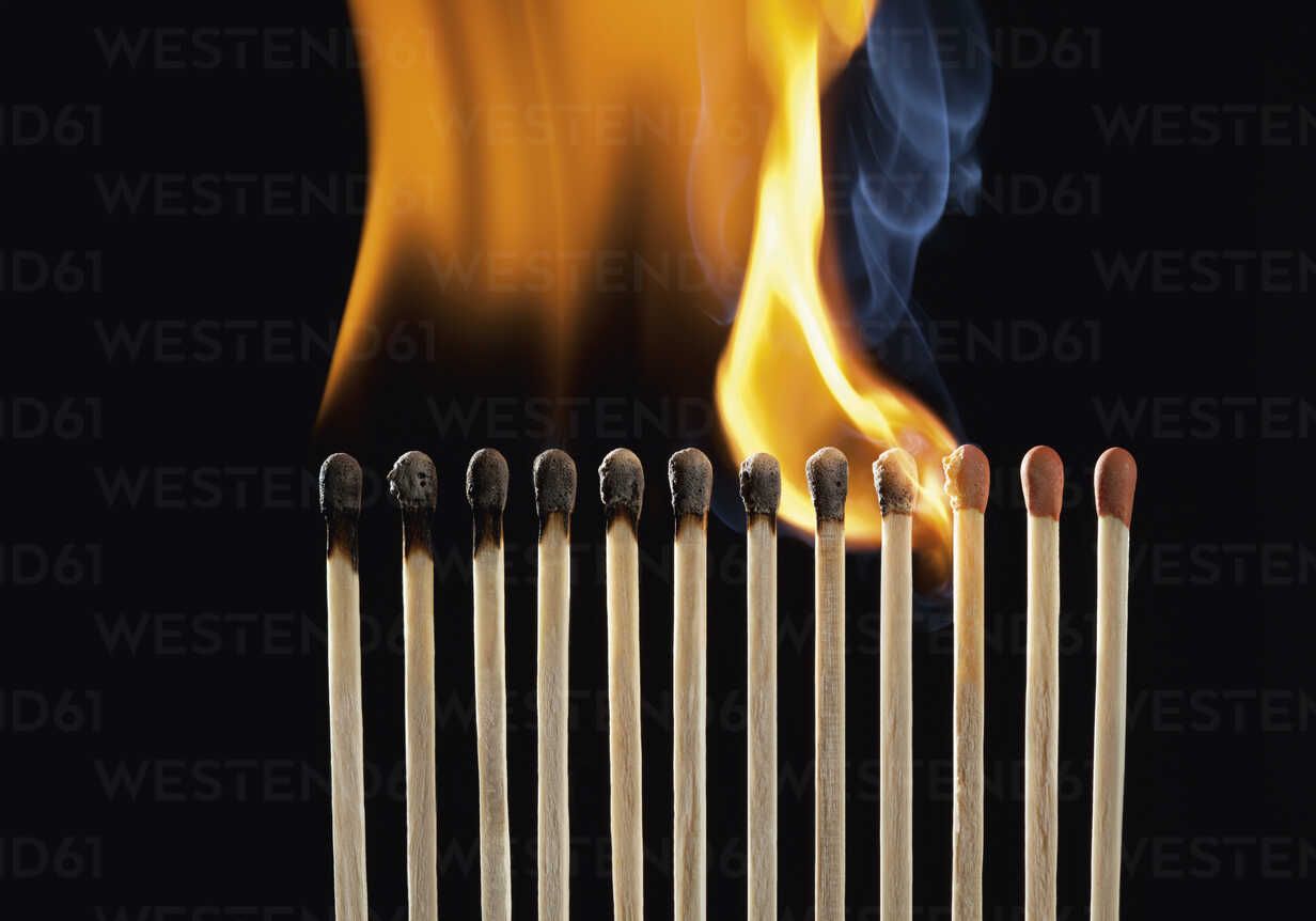 1232x862 Burning matchsticks against black background, close up