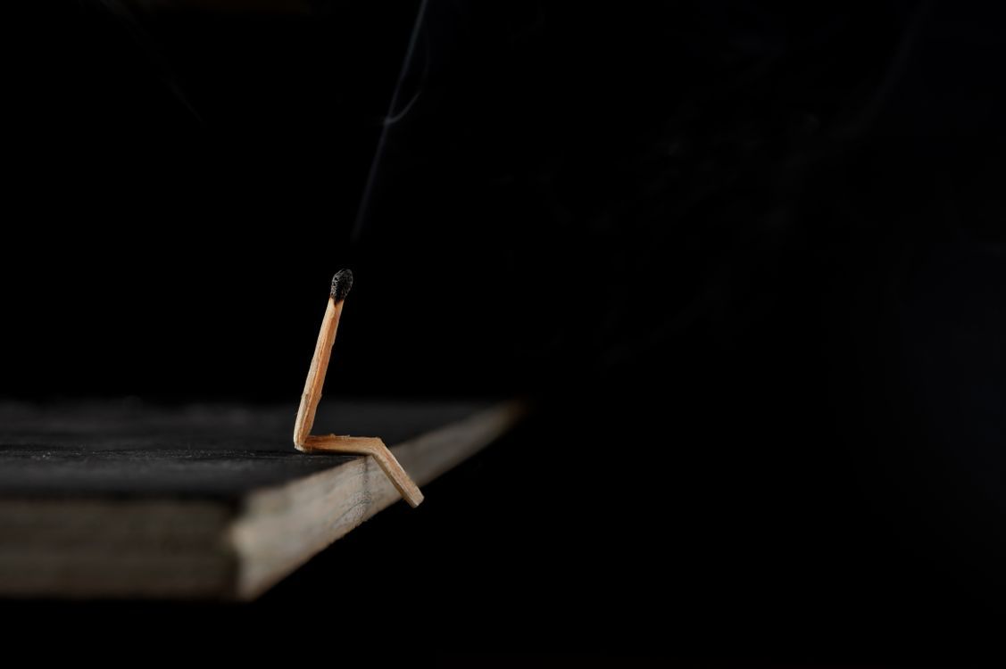 1127x750 Conceptual Artistic Image of a Bent Matchstick · Free