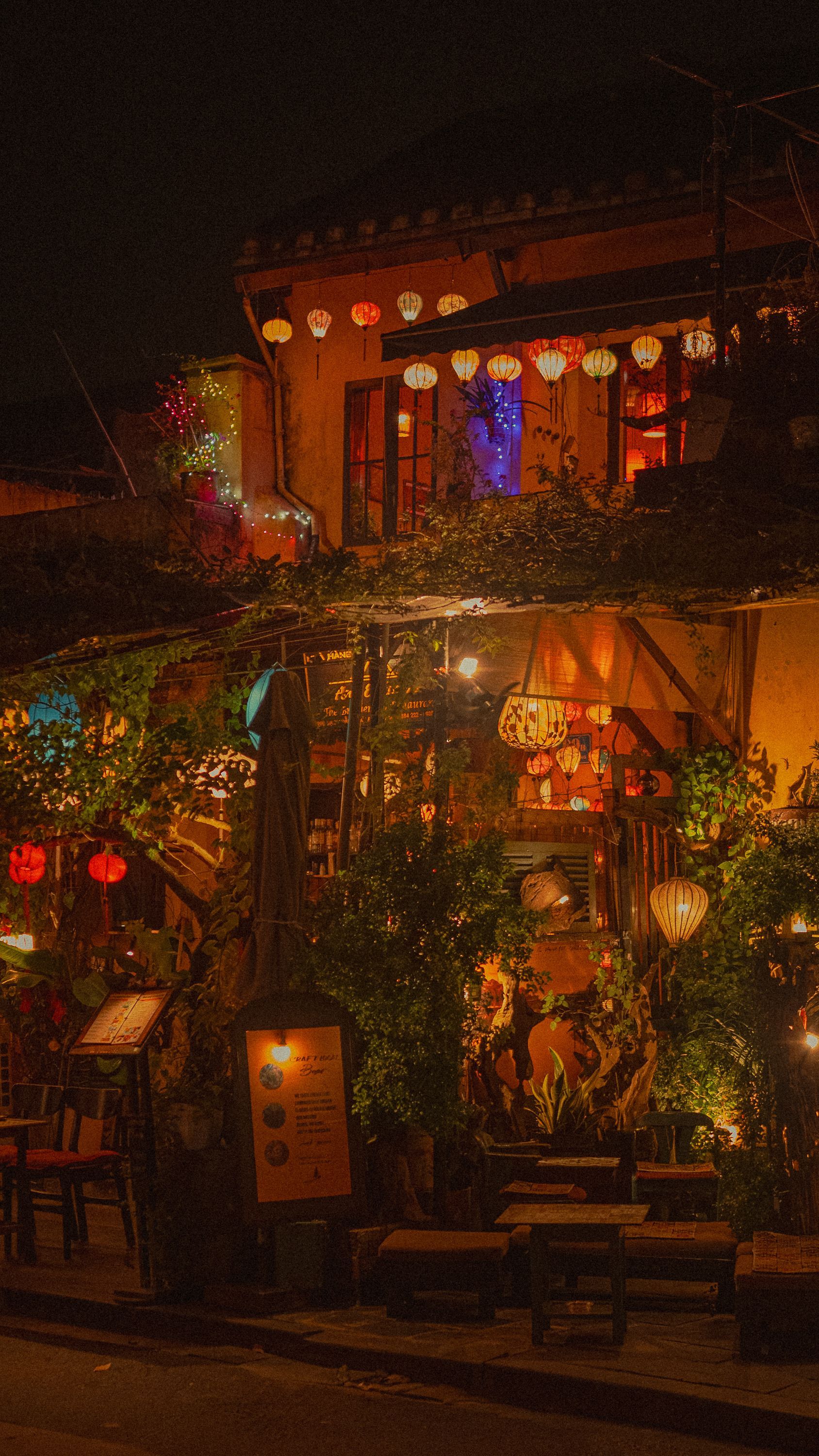 1688x3000 Charming Nighttime Cafe with Lantern Decor · Free