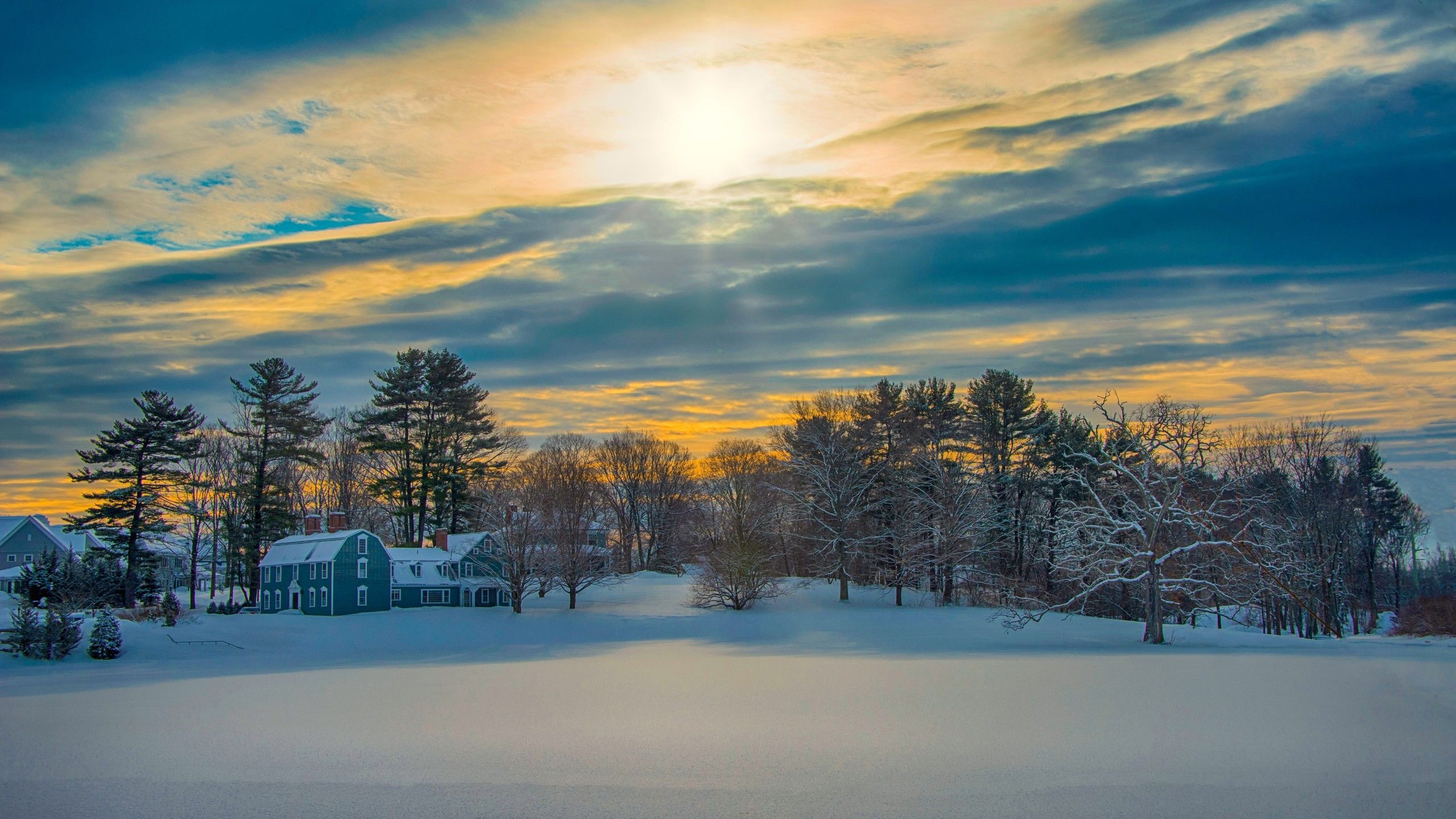 2560x1440 Snow Covered House Under Sky During Sunset 4K 5K HD Winter Wallpaper